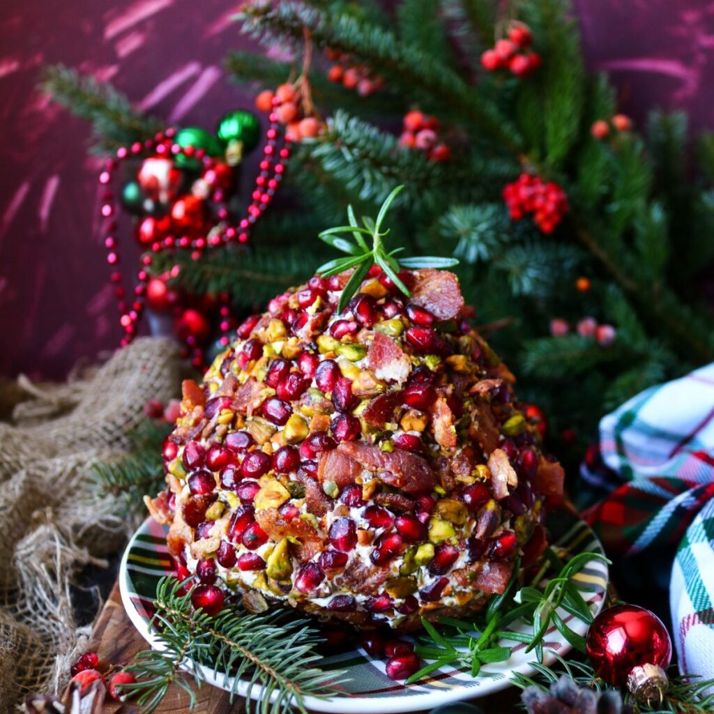 festive holiday cheese ball with pistachios, cranberries and bacon