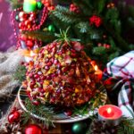 festive holiday cheese ball with pistachios, cranberries and bacon