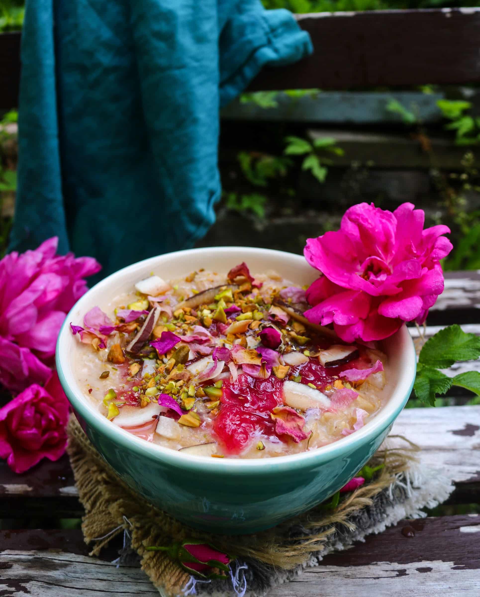 This rose coconut cardamom oatmeal is a creamy, aromatic breakfast made with coconut milk, rolled oats, rose jam, and warm cardamom