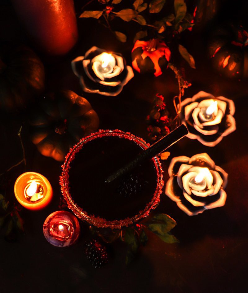Close-up of Black Licorice Cocktail showing deep black hue from licorice syrup and whiskey — Halloween drink idea.
