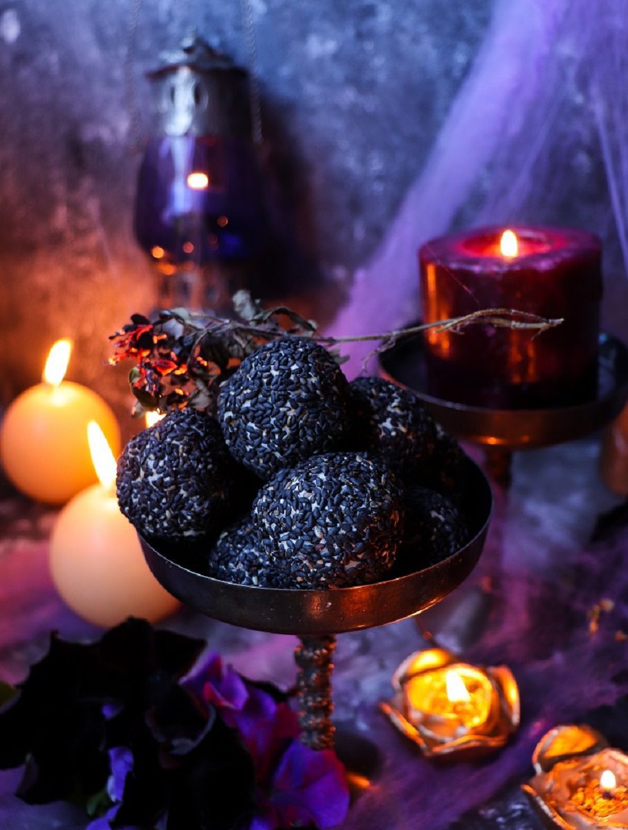 Black Sesame Cheese Balls on a platter — creamy cheddar and cream cheese rolled in toasted sesame seeds, elegant Halloween appetizer.