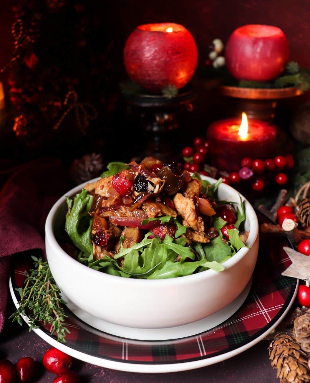 Holiday Leftover Turkey Salad with cranberries, chestnuts, and caramelized onions served over fresh arugula in a festive bowl — a warm, savoury salad perfect for using up Christmas turkey leftovers.