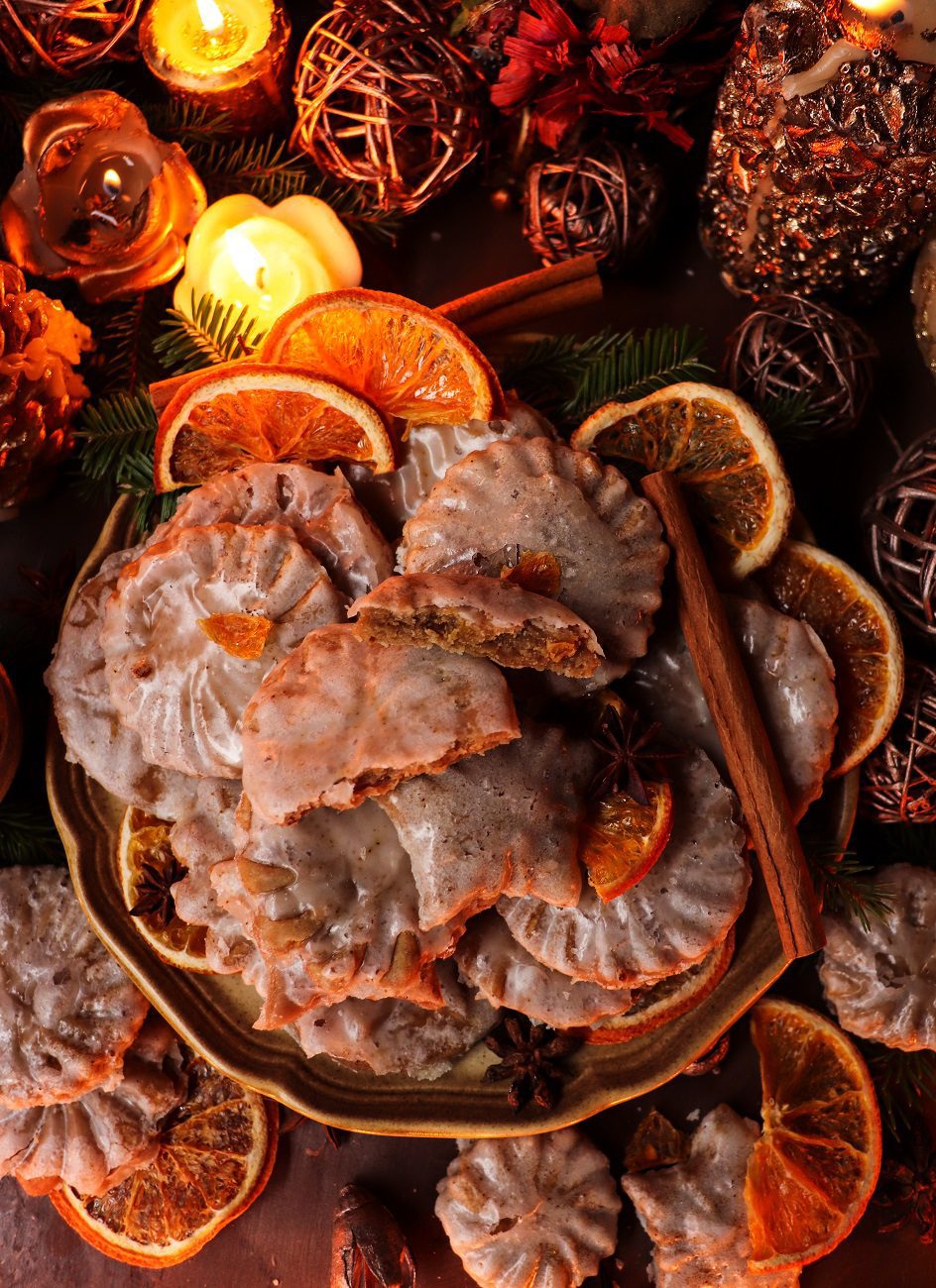 Festive orange-clove cookies with citrus glaze and warm holiday spices, perfect for Christmas baking.