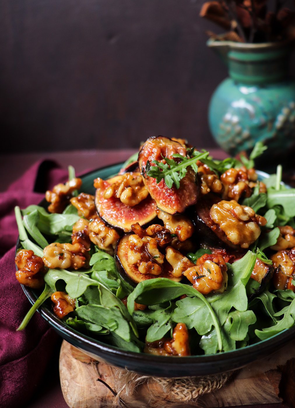 Caramelized fig walnut salad with luscious honey-glazed figs, buttery walnuts, and fresh greens served in a ceramic bowl.