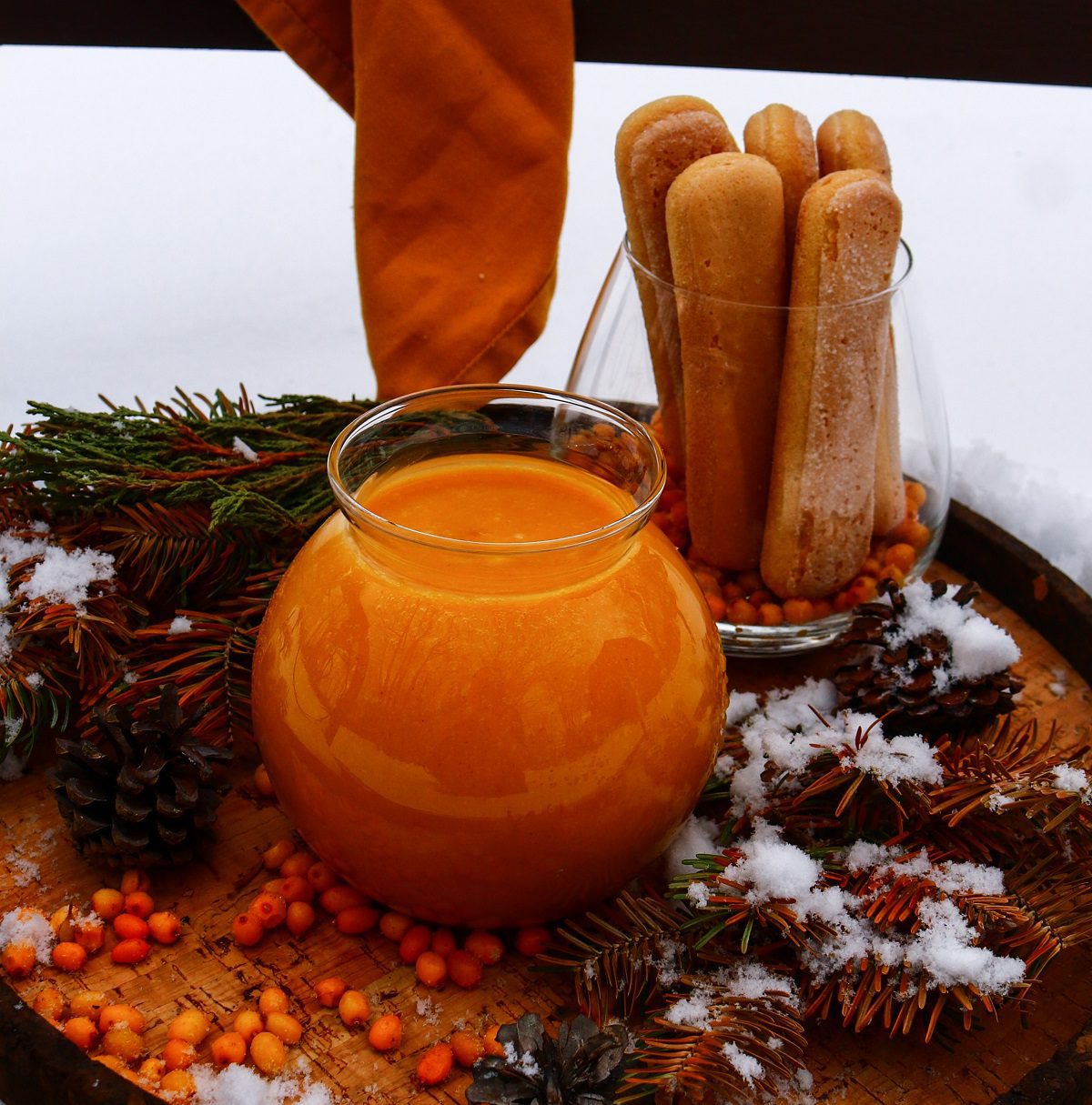 Seaberry curd in a jar with sponge biscuits for serving.