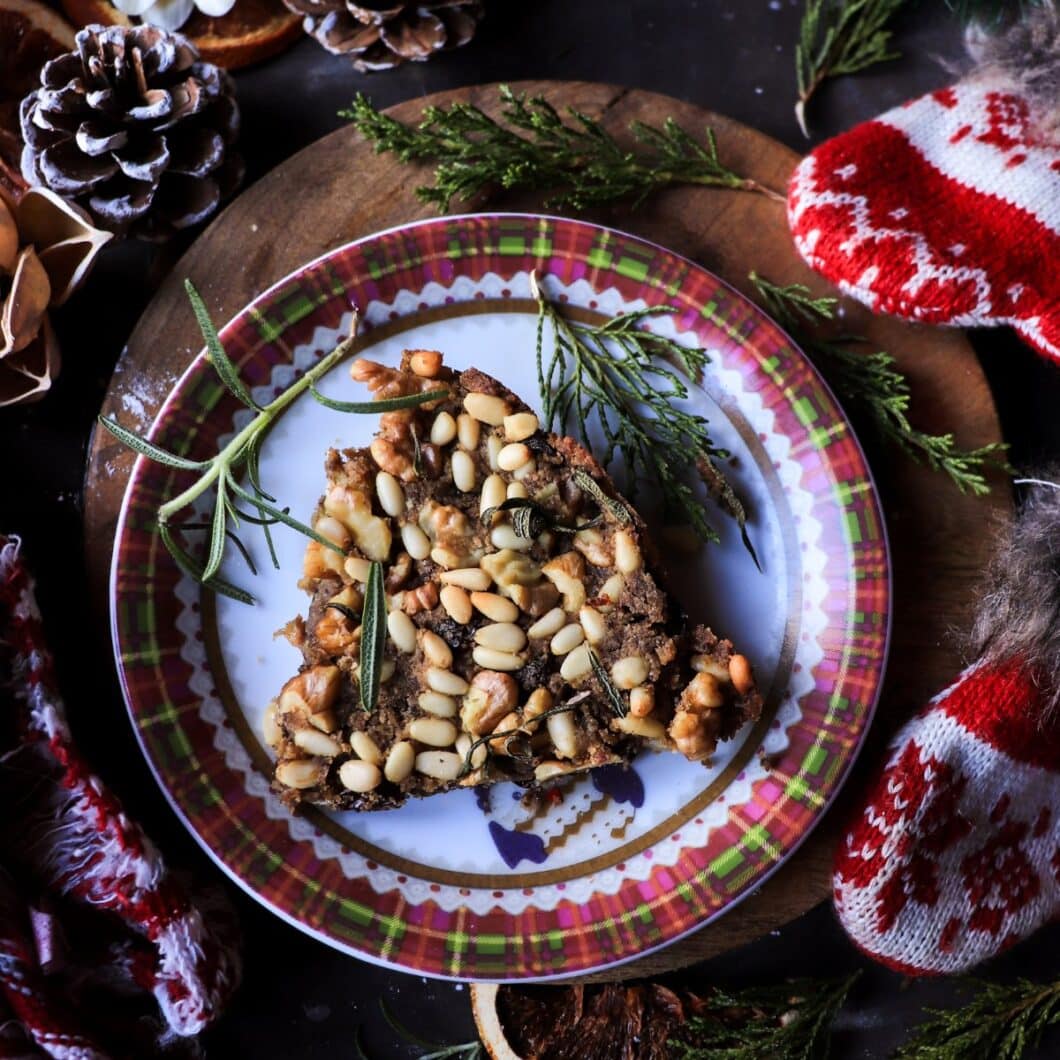 Castagnaccio - Tuscan Chestnut Flour Cake with Raisins, Pine Nuts, and Walnuts