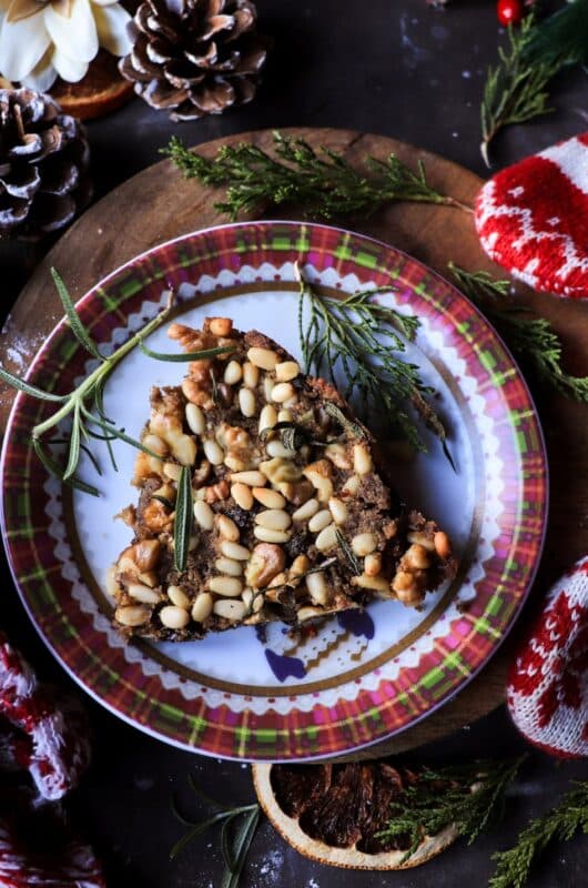 Castagnaccio - Tuscan Chestnut Flour Cake with Raisins, Pine Nuts, and Walnuts