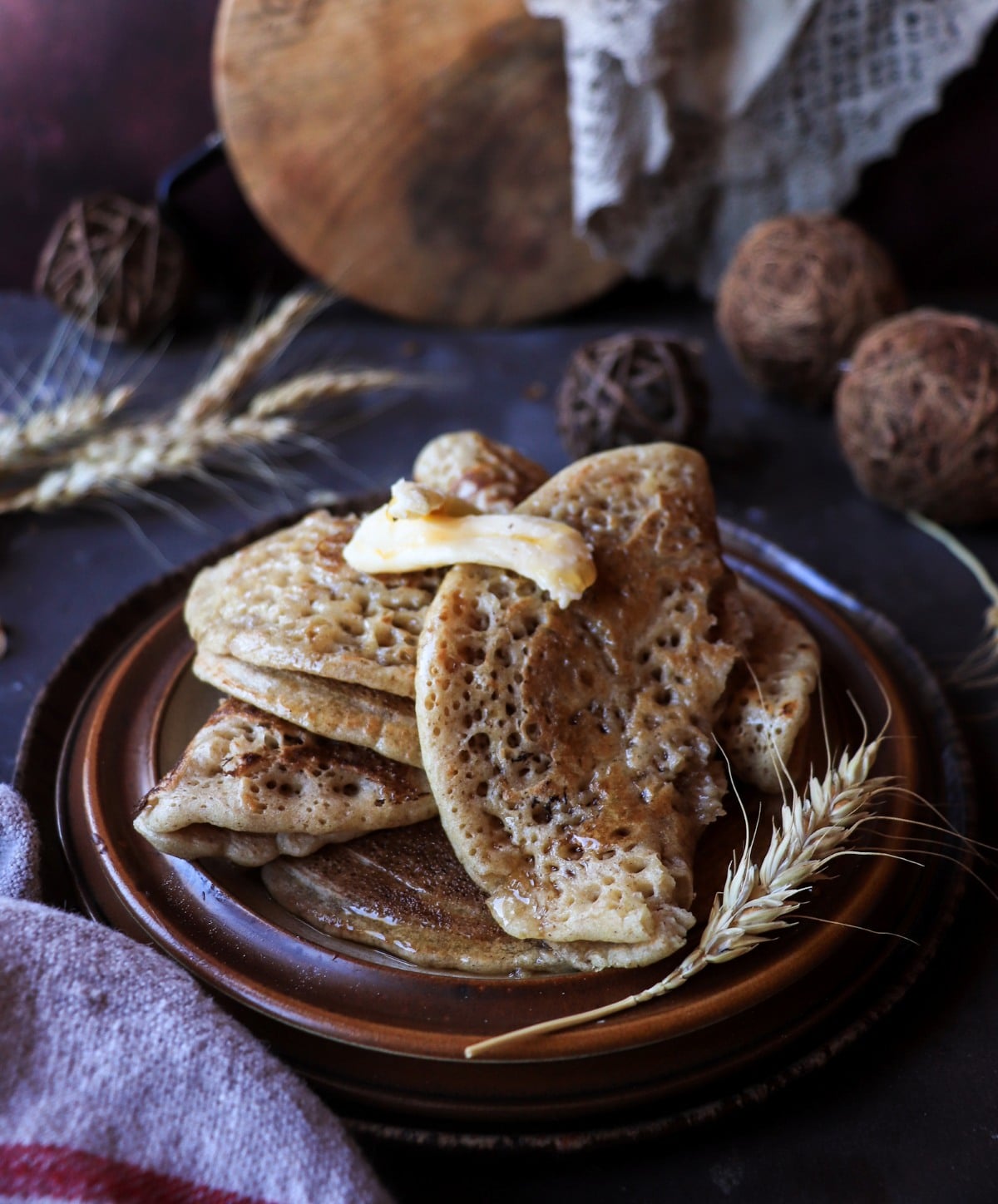 Folded Acadian ployes with slightly deeper browning, illustrating the optional brief flip for added colour.