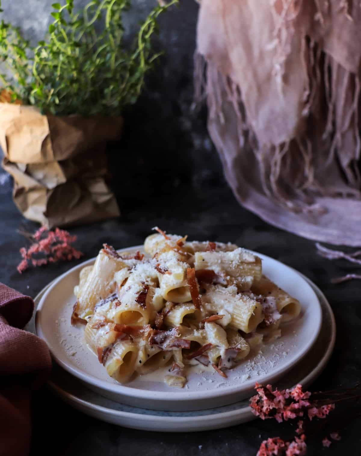 Creamy Speck Pasta (Pasta con Speck e Panna) served in a shallow bowl with silky sauce, speck, and freshly grated Parmigiano.