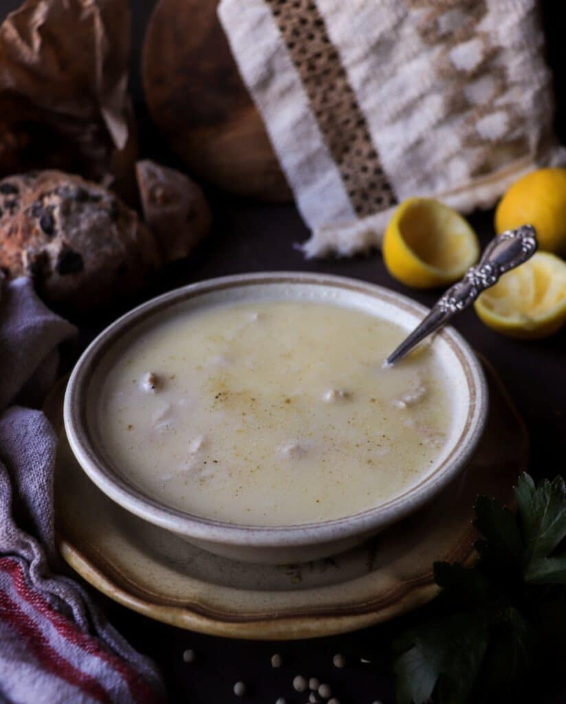 Traditional Greek avgolemono soup with shredded chicken and rice in a silky egg-lemon broth.