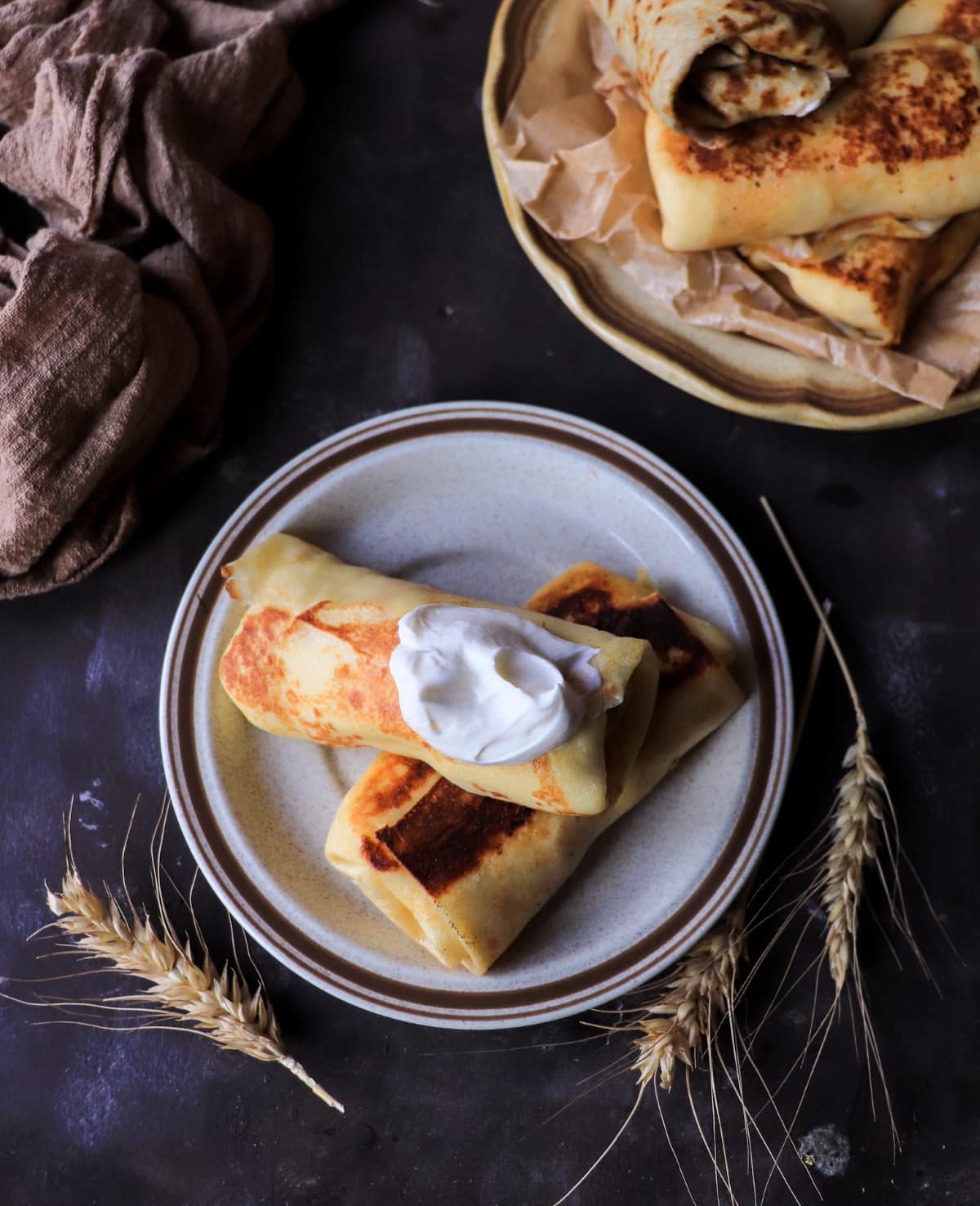 crepes with cottage cheese filling served with sour cream