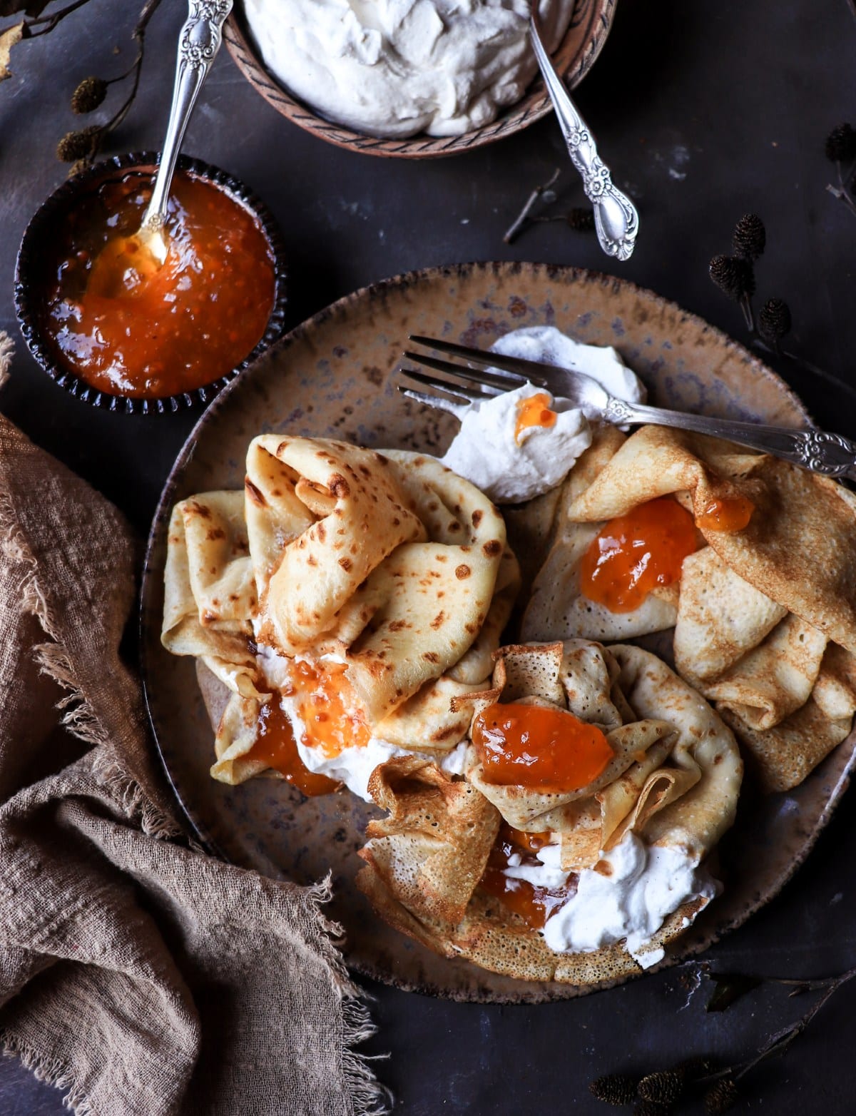 Crepes with cloudberries and whipped cream