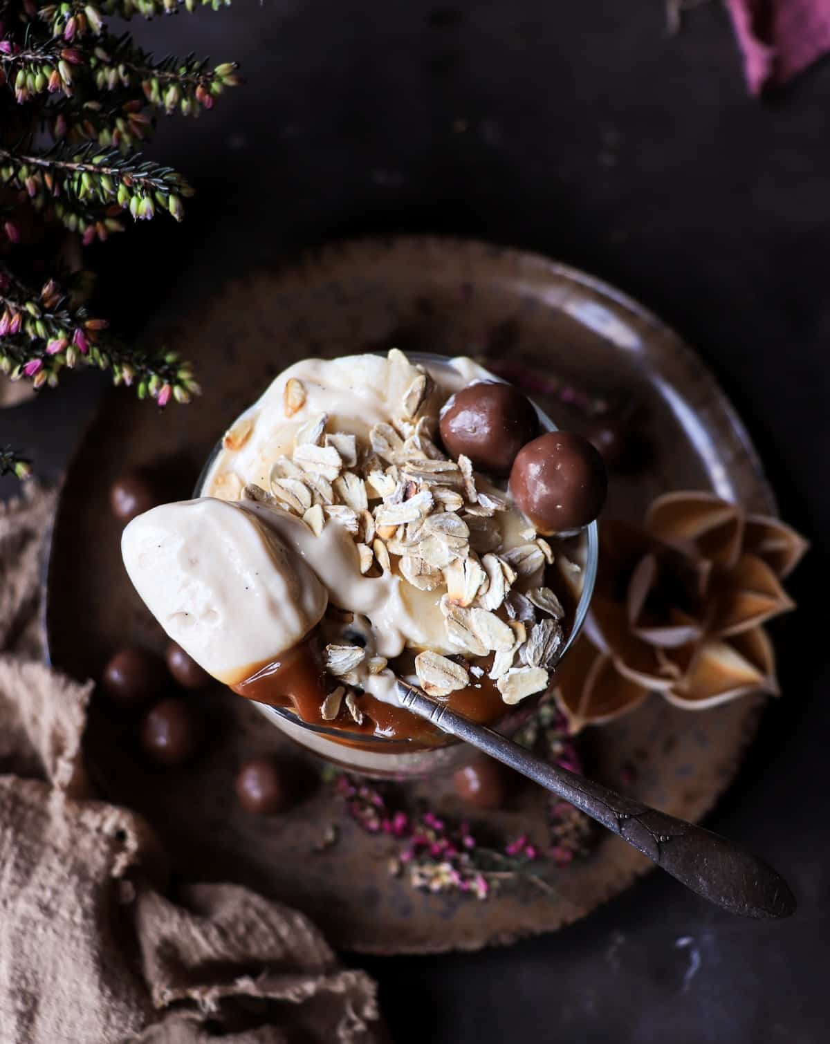 Greek yogurt parfait with dulce de leche, banana slices, and crunchy oats