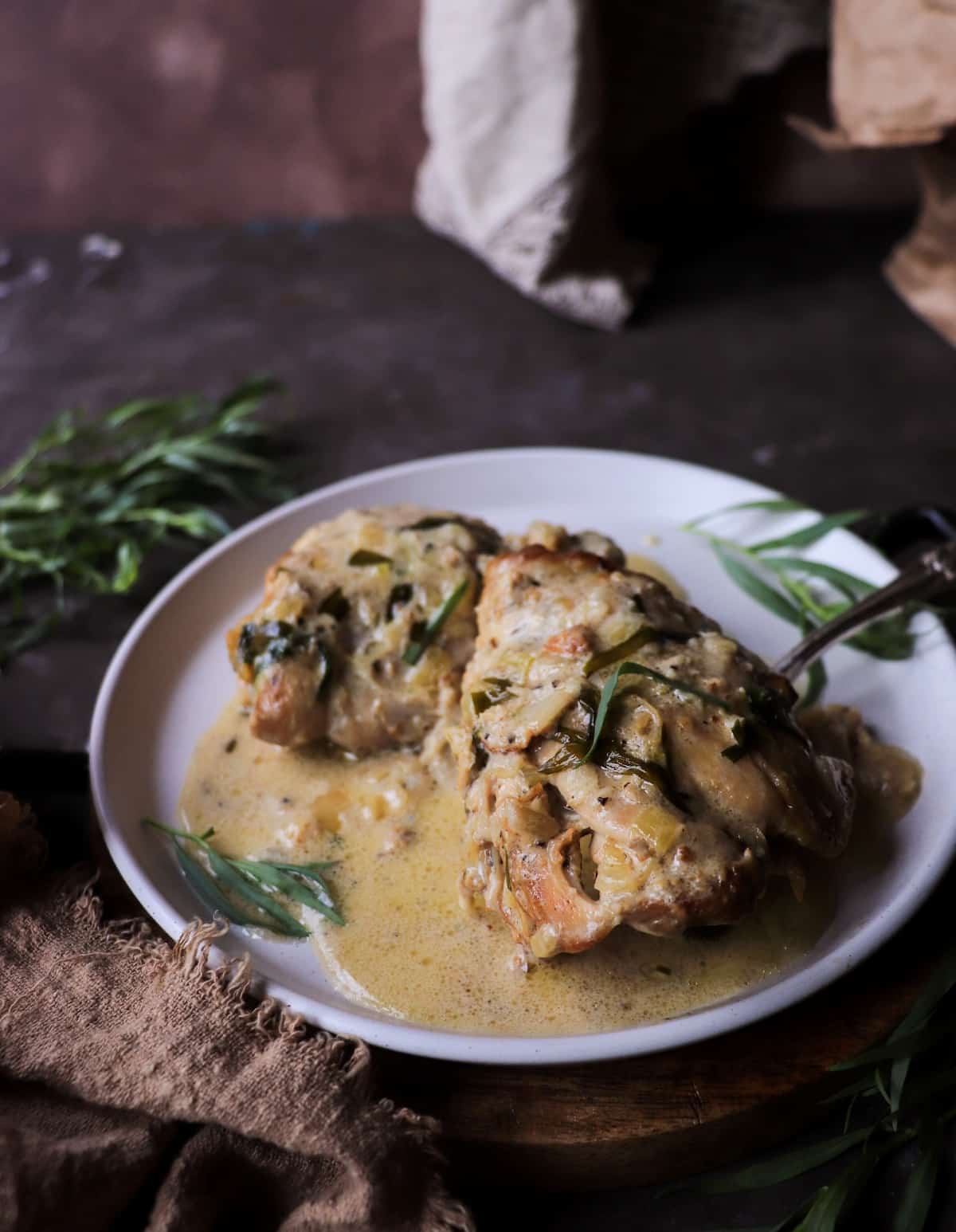 Chicken with tarragon cream sauce made with white wine, shallots, and fresh tarragon.