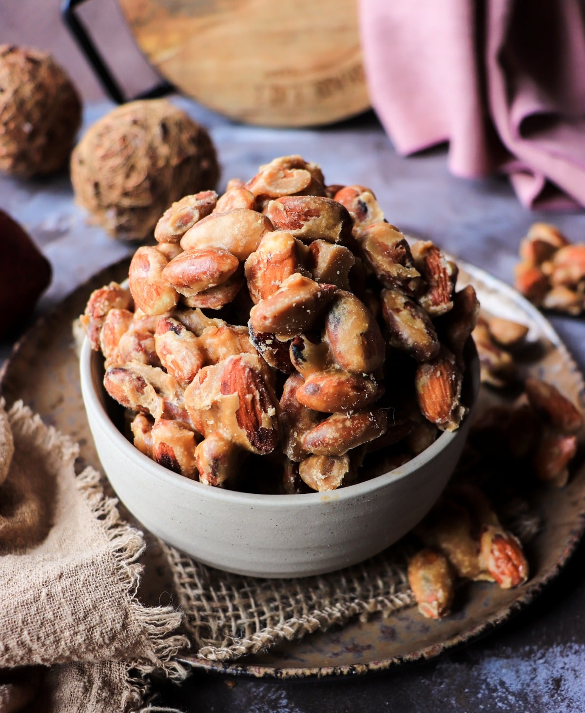 Frosted maple candied almonds in a bowl with a soft crystallized sugar coating (stovetop recipe)