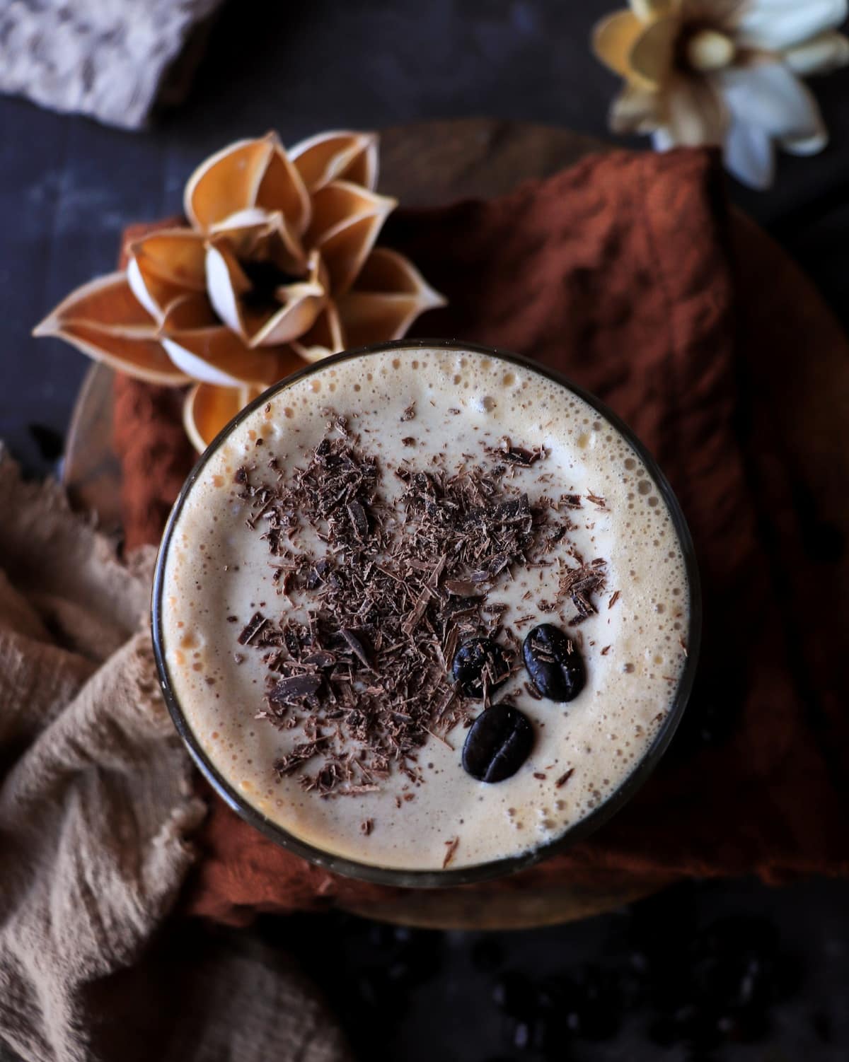 Creamy coffee milkshake with Kahlua photographed from above with chocolate garnish.