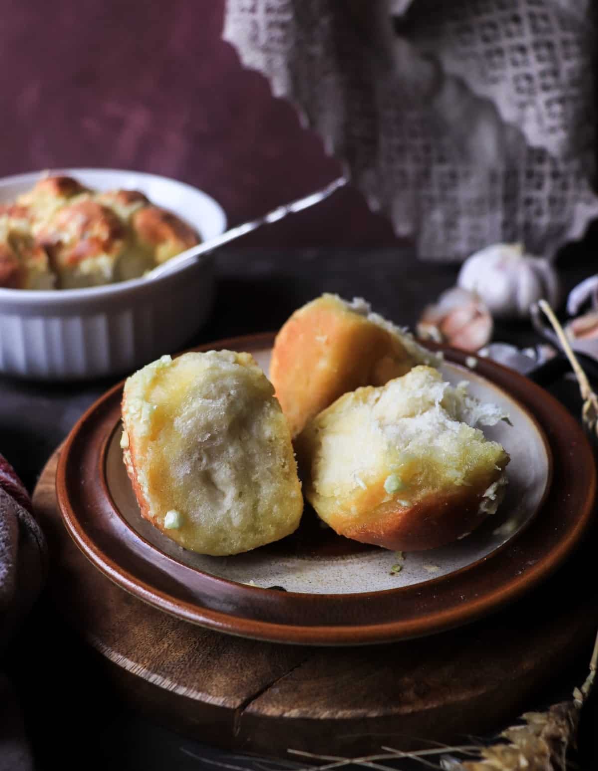 Soft interior of homemade Ukrainian garlic bread buns with garlic oil topping.