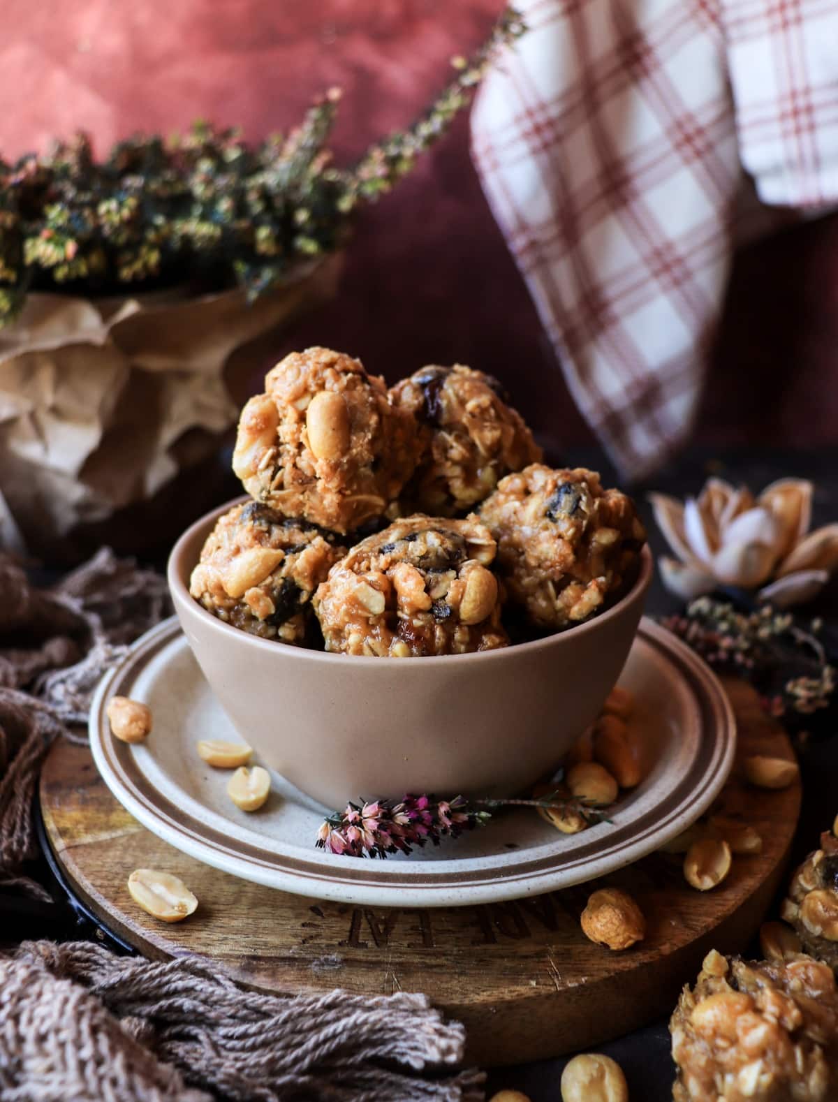 Peanut butter oat bites with cornflakes, maple and raisins in a rustic bowl.