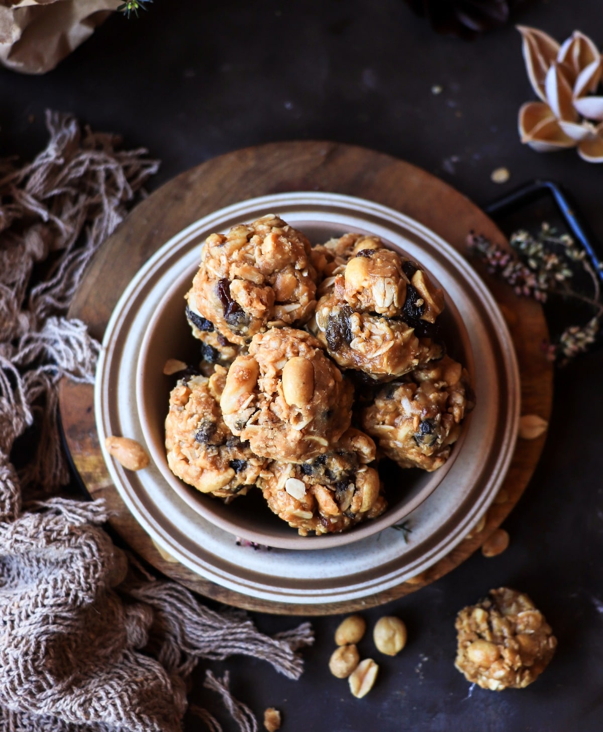 Overhead view of peanut butter energy bites with oats and salted peanuts.