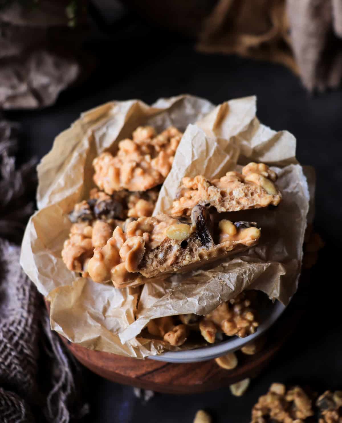 Close up of Peanut Butterscotch Cornflake Clusters showing peanuts, raisins and vanilla specks