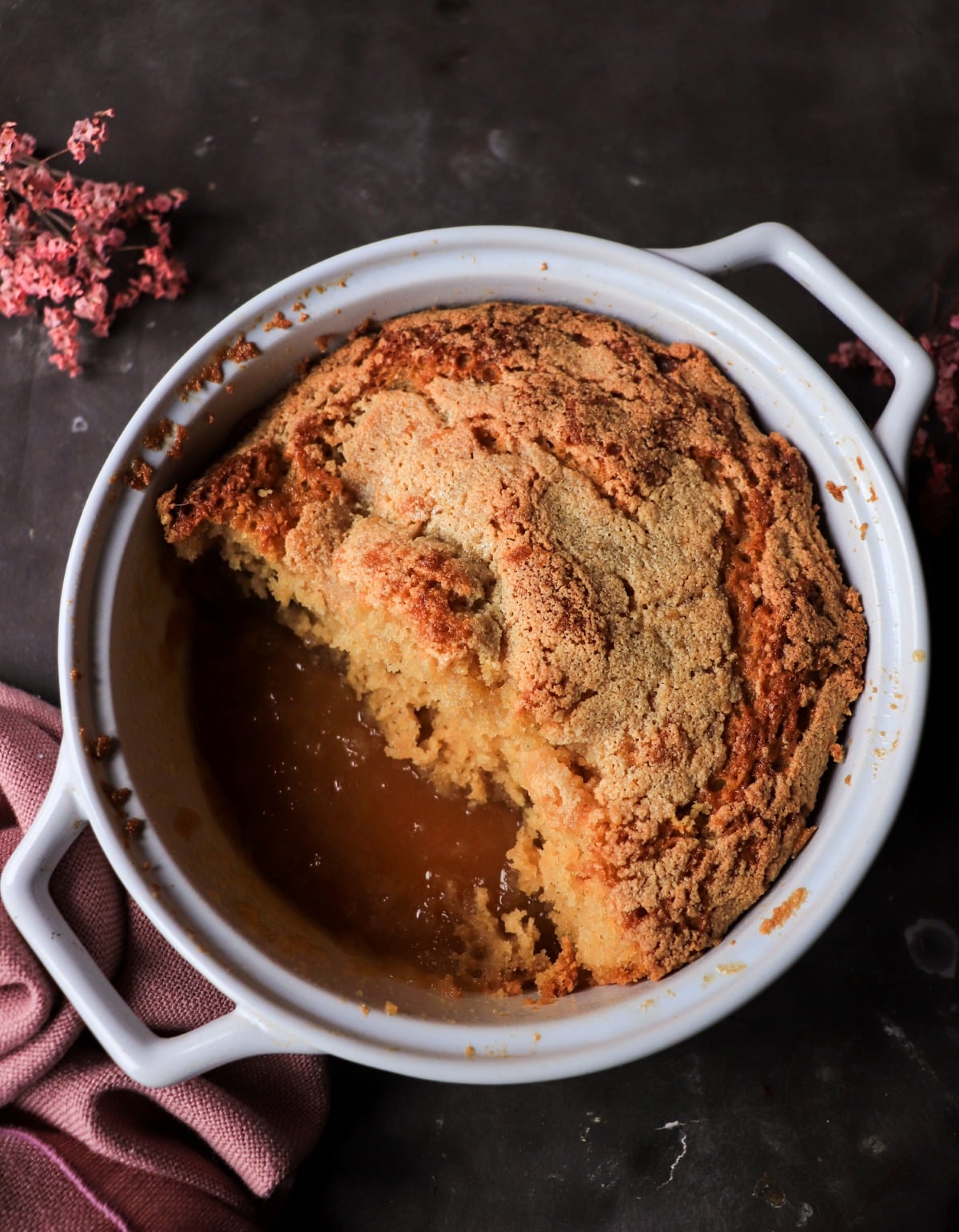 Pouding chômeur showing soft cake and rich maple syrup sauce underneath after baking