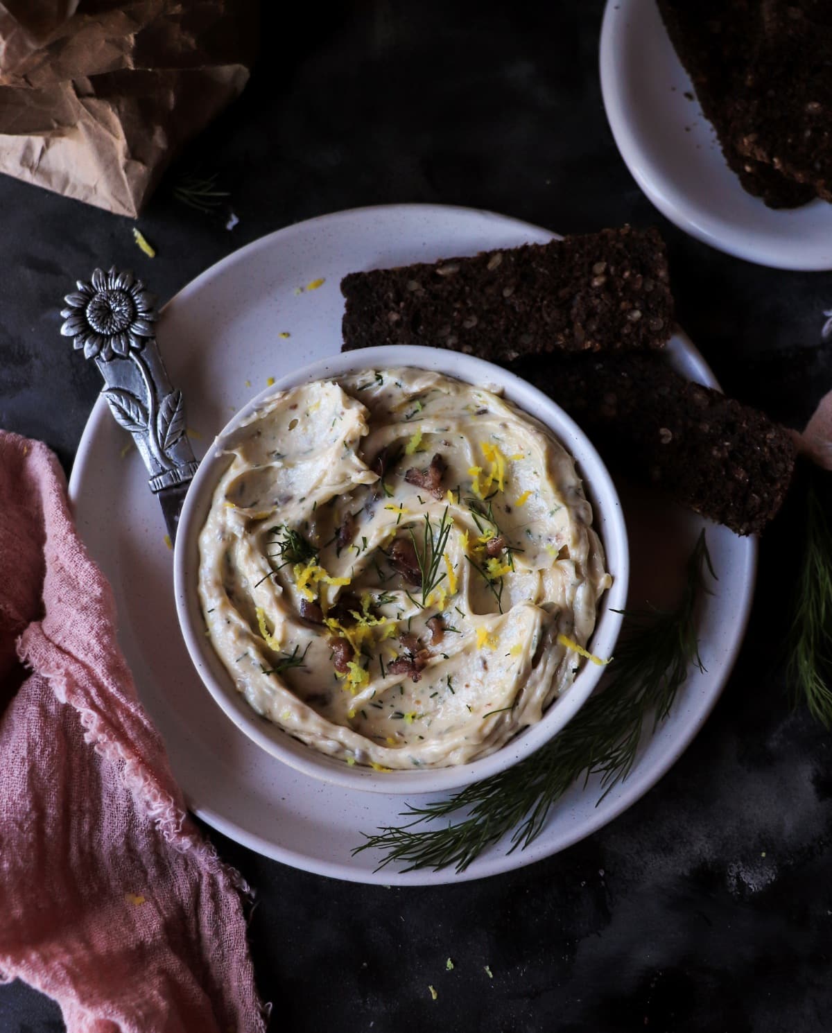 Anchovy butter served with pumpernickel rye bread
