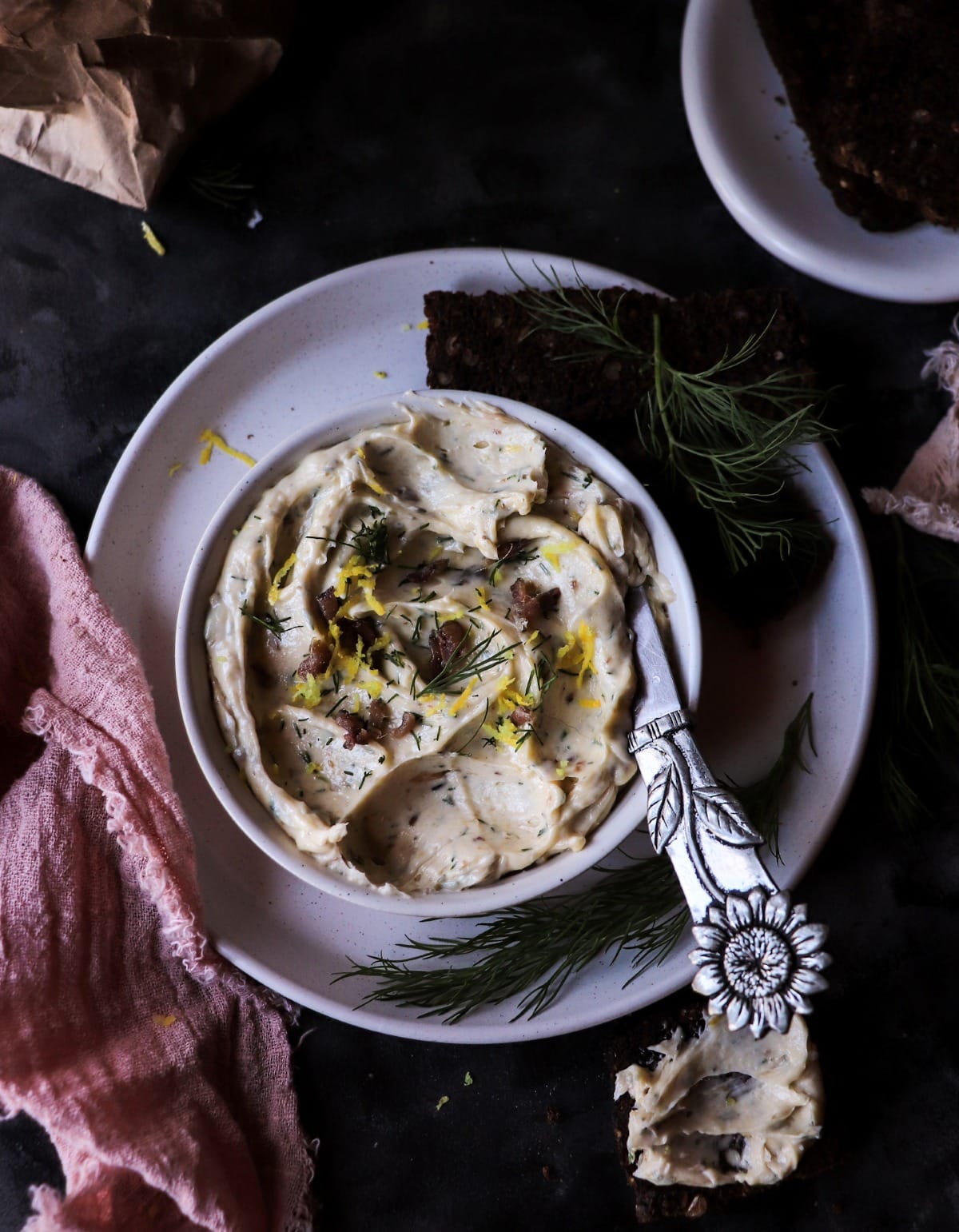 Creamy anchovy butter texture with dill and lemon zest