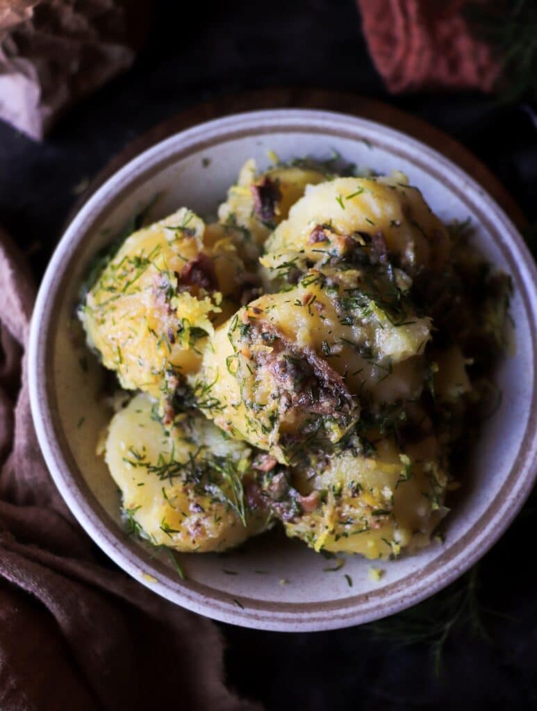 Rustic boiled potatoes with anchovy, lemon zest and dill.