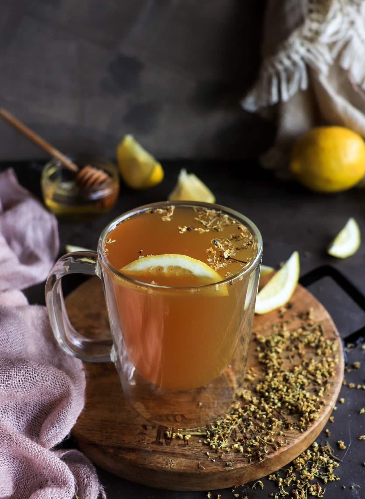 Elderflower tea made from dried elderflowers with fresh lemon and honey
