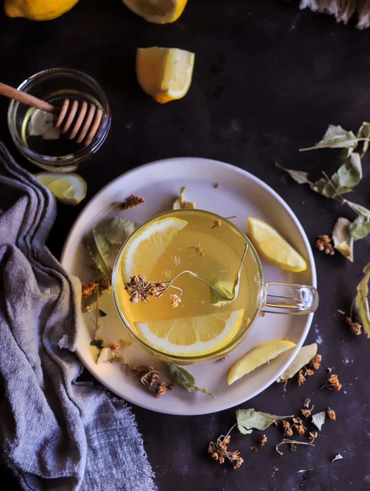 Hot herbal linden tea with lemon and dried linden flowers