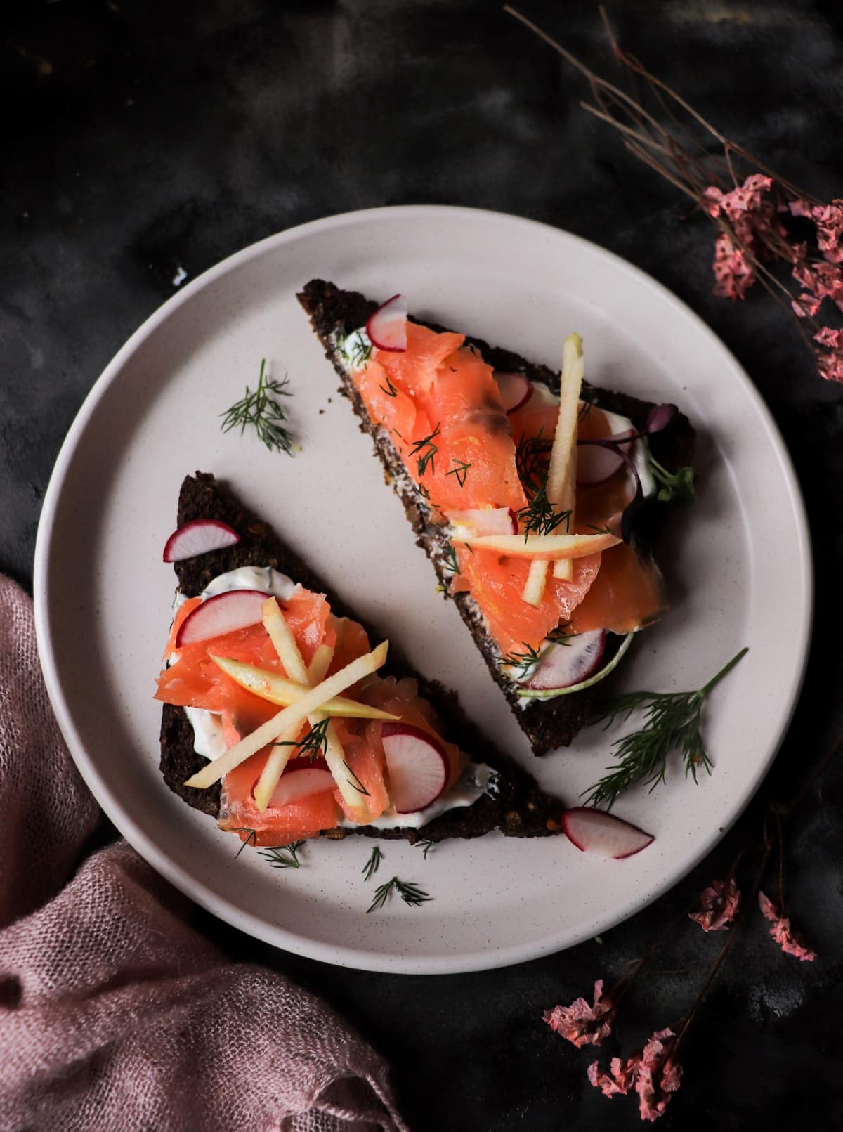 Scandinavian smoked salmon toast with horseradish and apple garnish