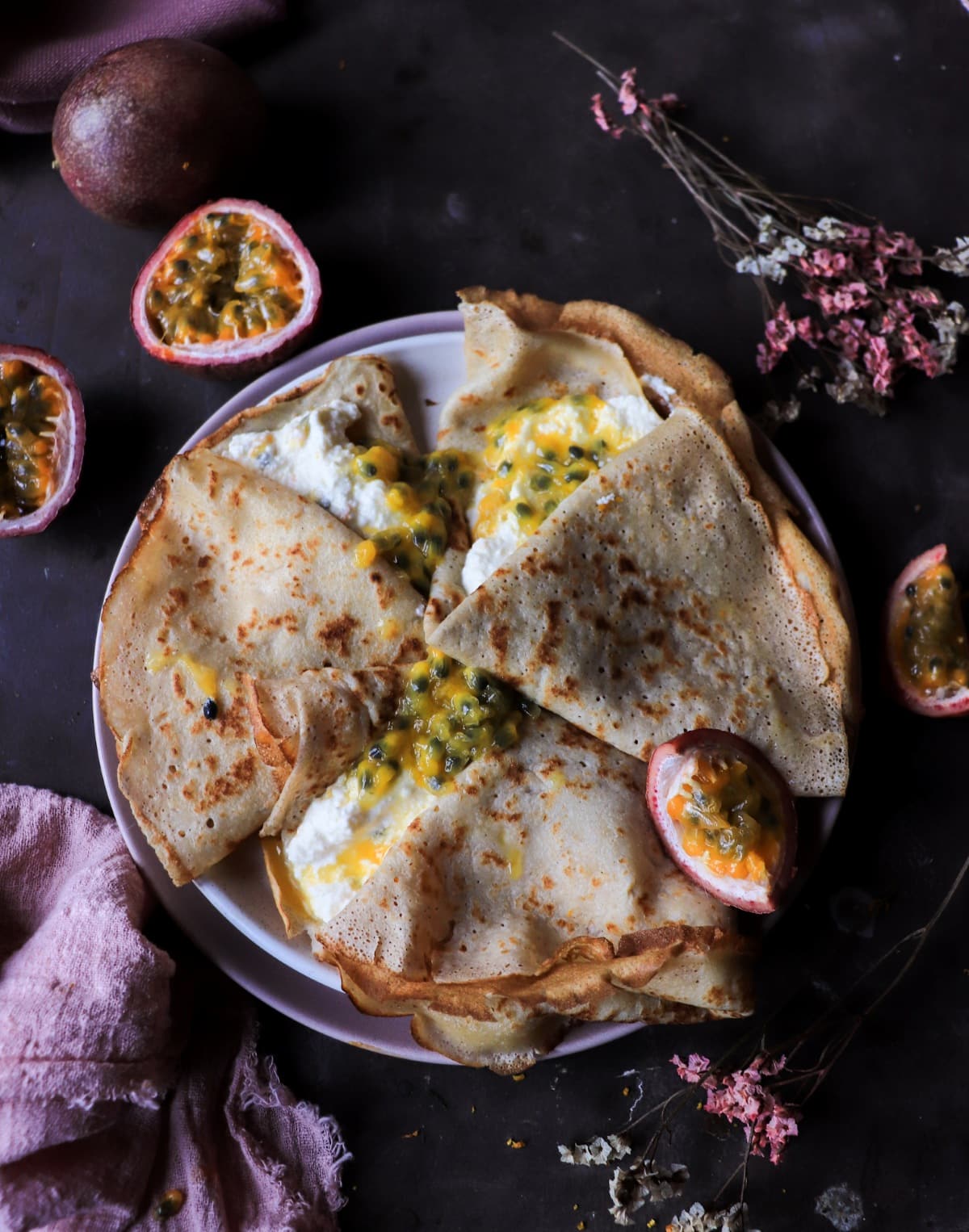 Ricotta-filled crêpes with fresh passion fruit.