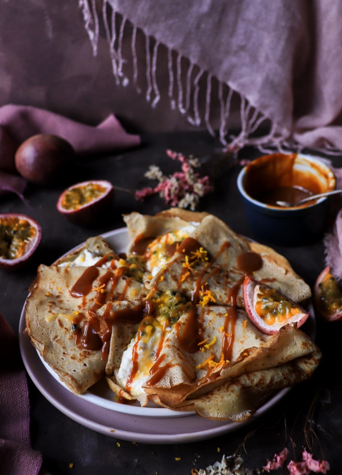 Passion fruit ricotta crêpes with dulce drizzle.