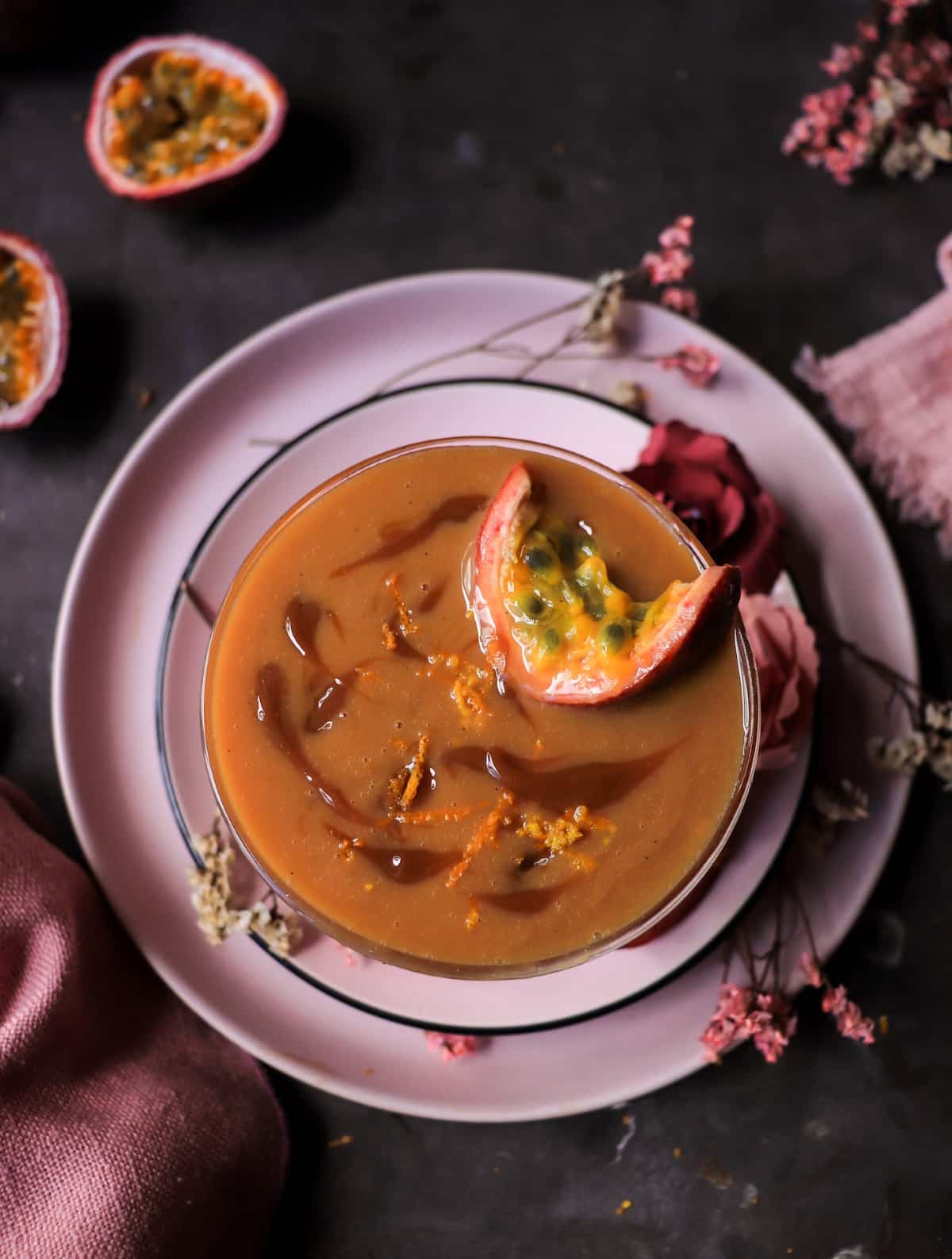 Creamy passion fruit rum cocktail with dulce de leche