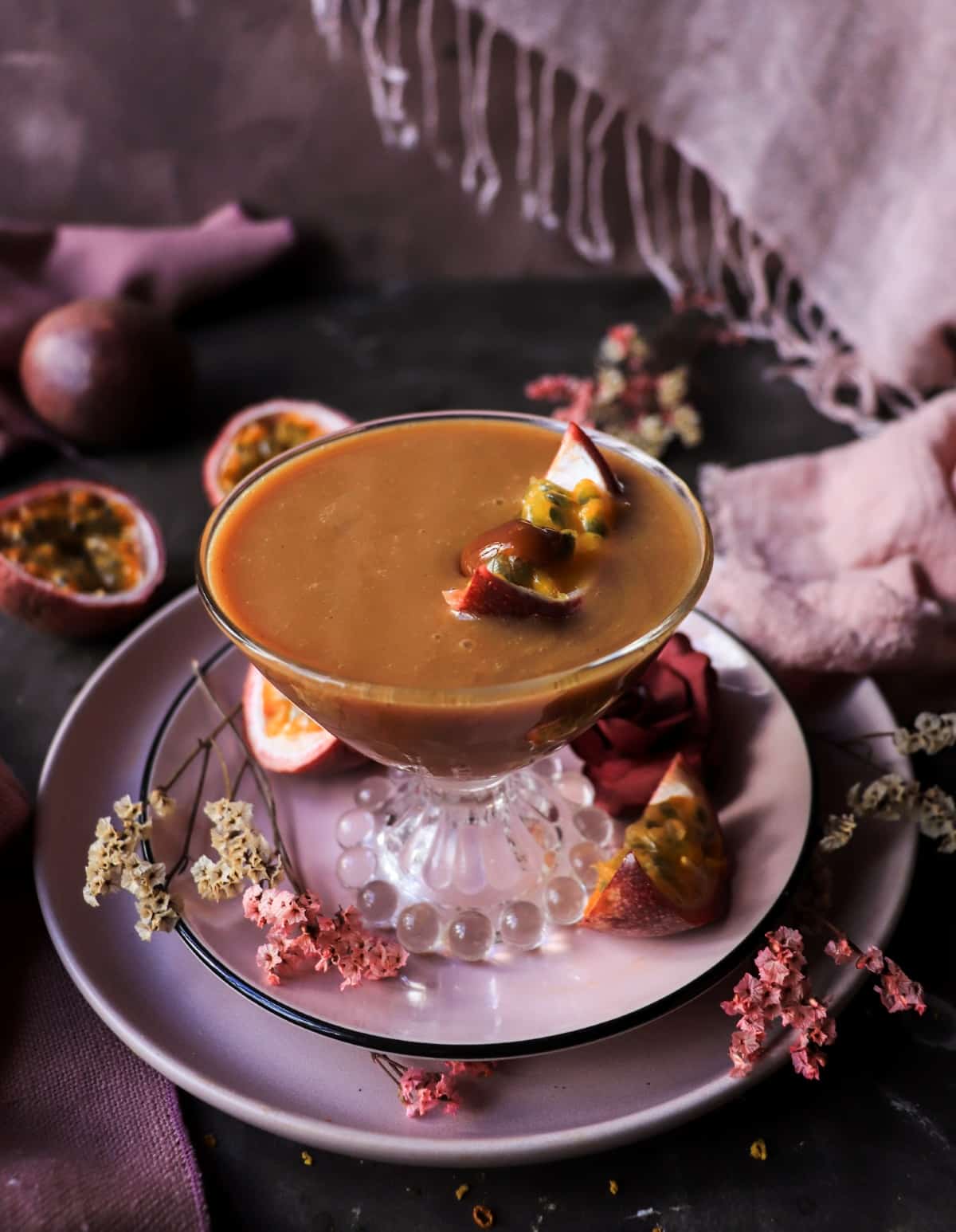 Dark rum, passion fruit liqueur, orange juice, and dulce de leche create a silky tropical dessert cocktail with caramel notes.