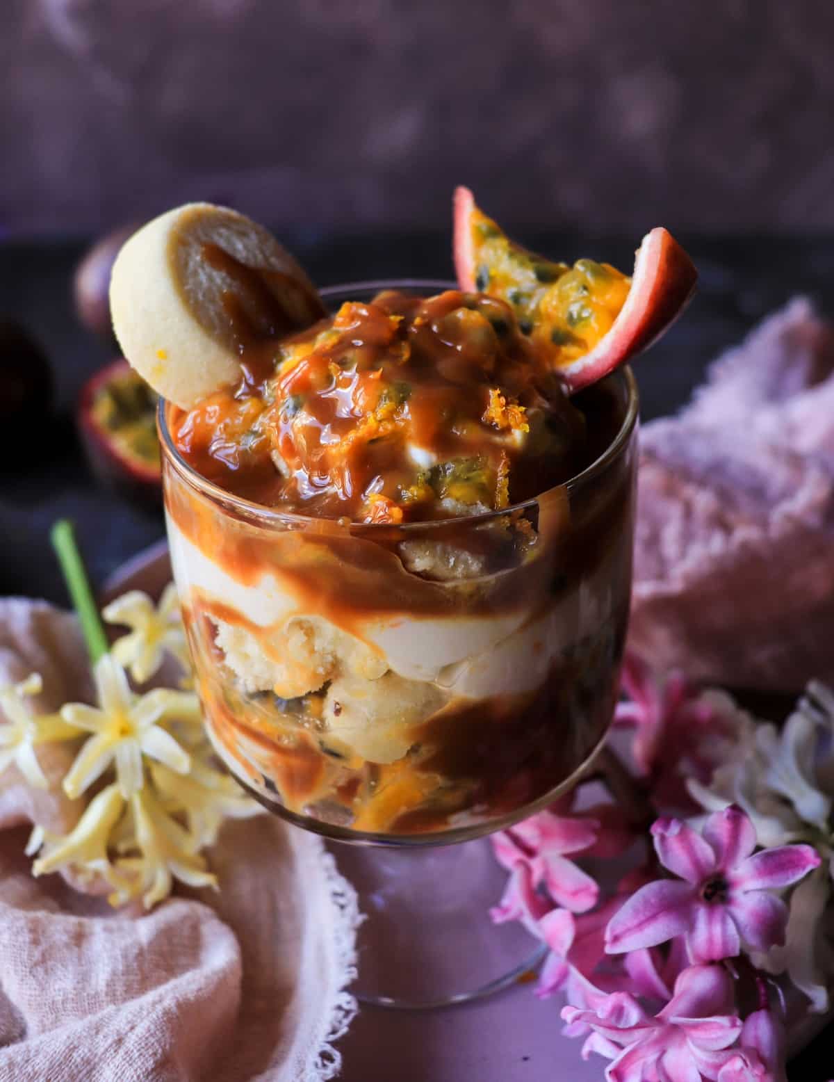 mascarpone trifle with dulce de leche, passion fruit, orange zest, and sable cookies.