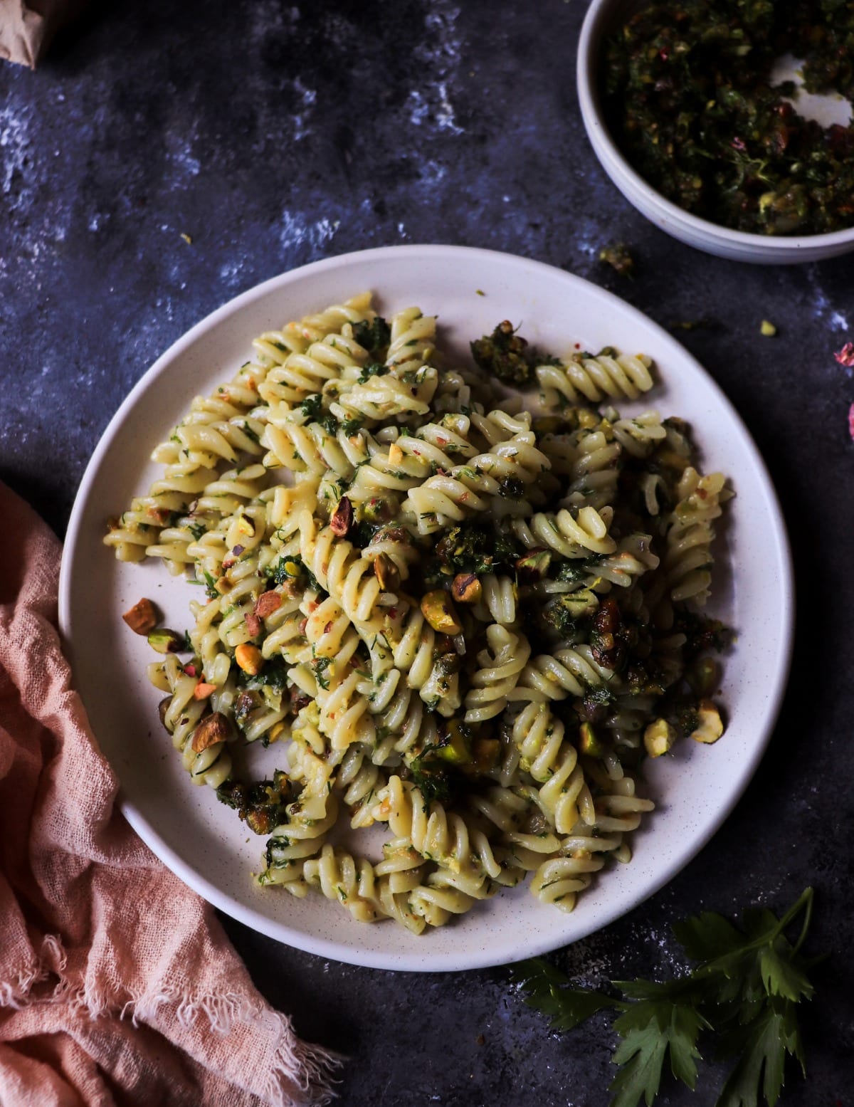 Homemade pasta with parsley, dill, pistachios, and gremolata.