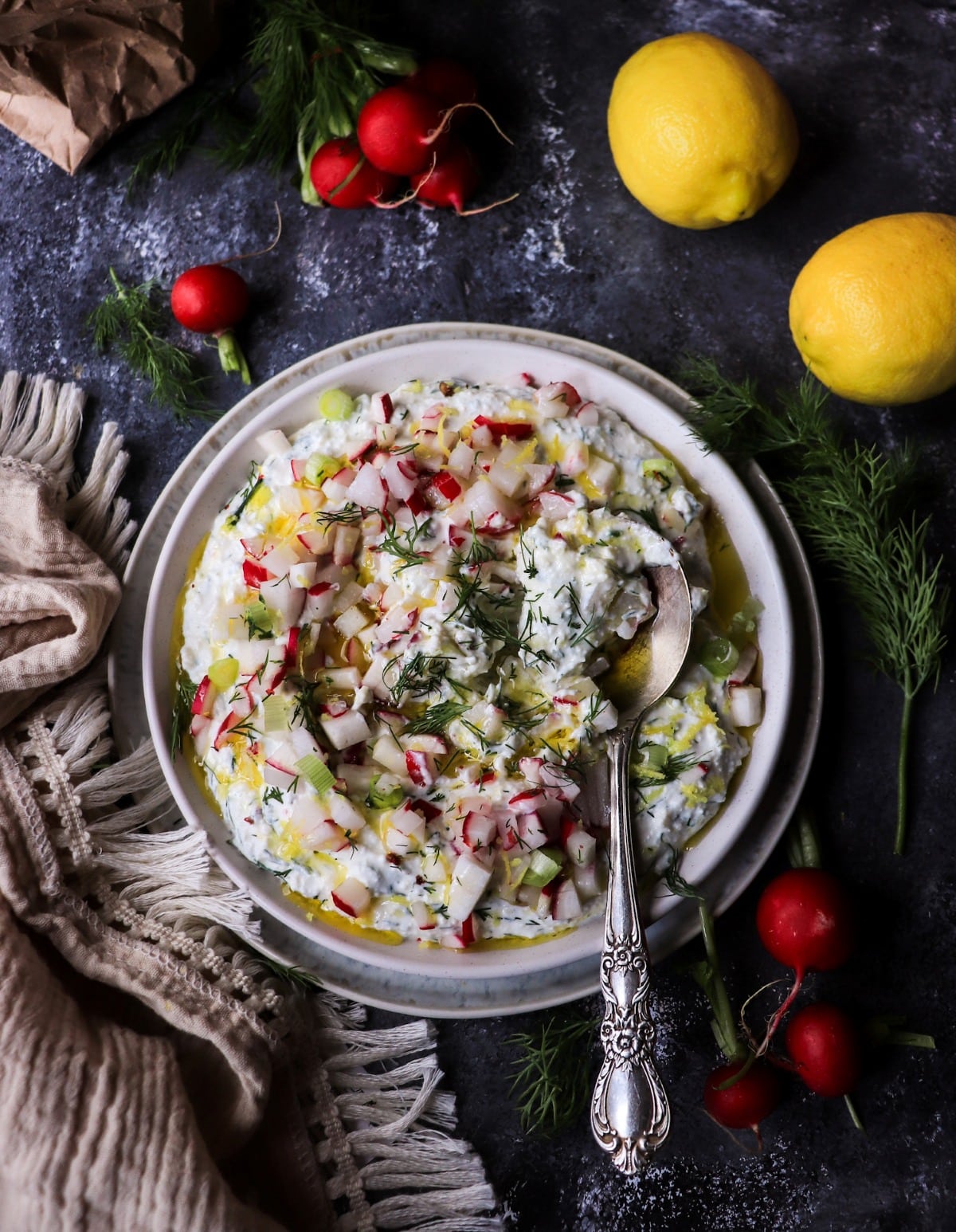 Mediterranean feta spread with radishes, lemon, dill, and olive oil