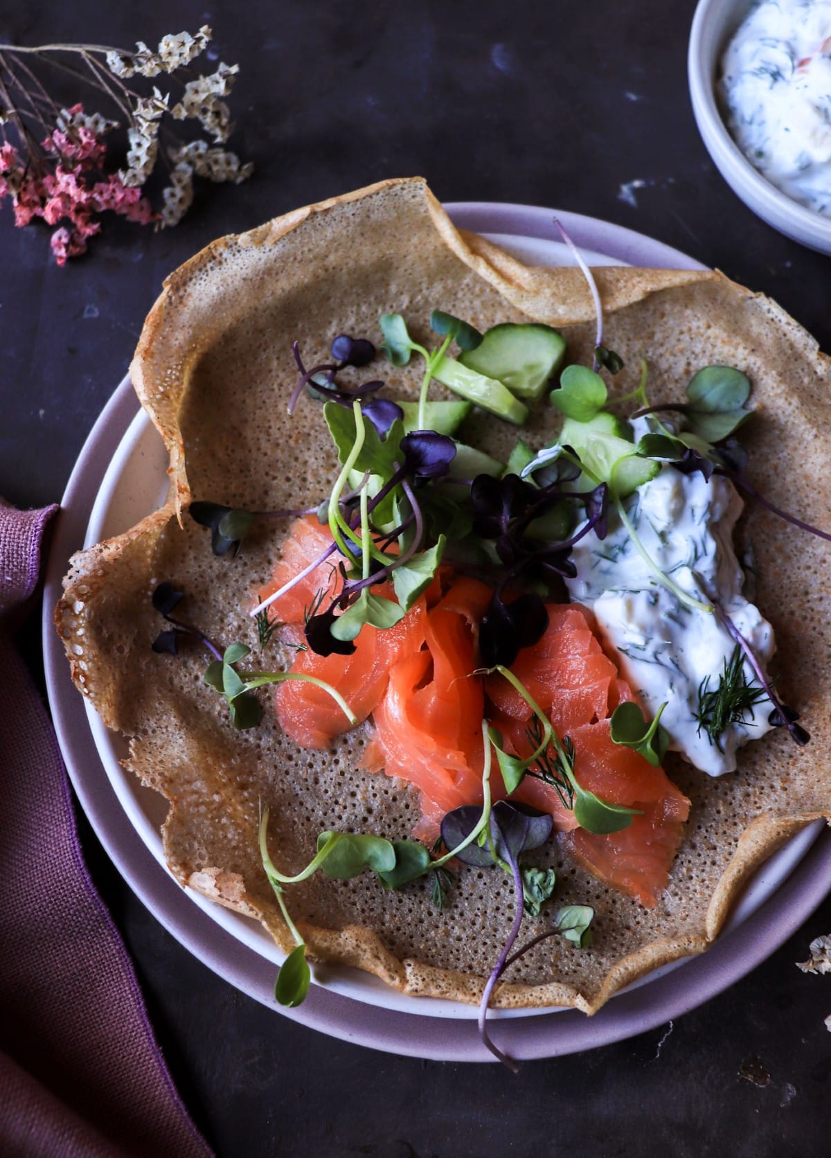 Nordic-style rye pancake with smoked salmon and horseradish apple sauce.