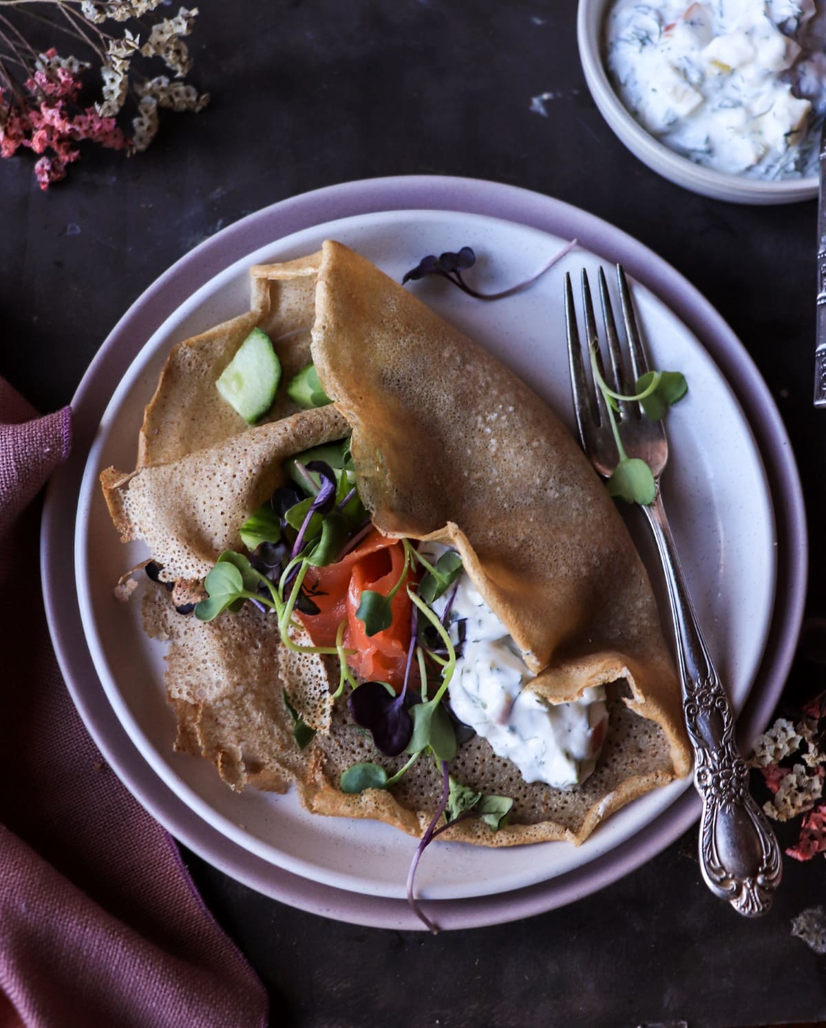 Nordic smoked salmon rye crêpe served with horseradish, apple, and dill yogurt sauce.