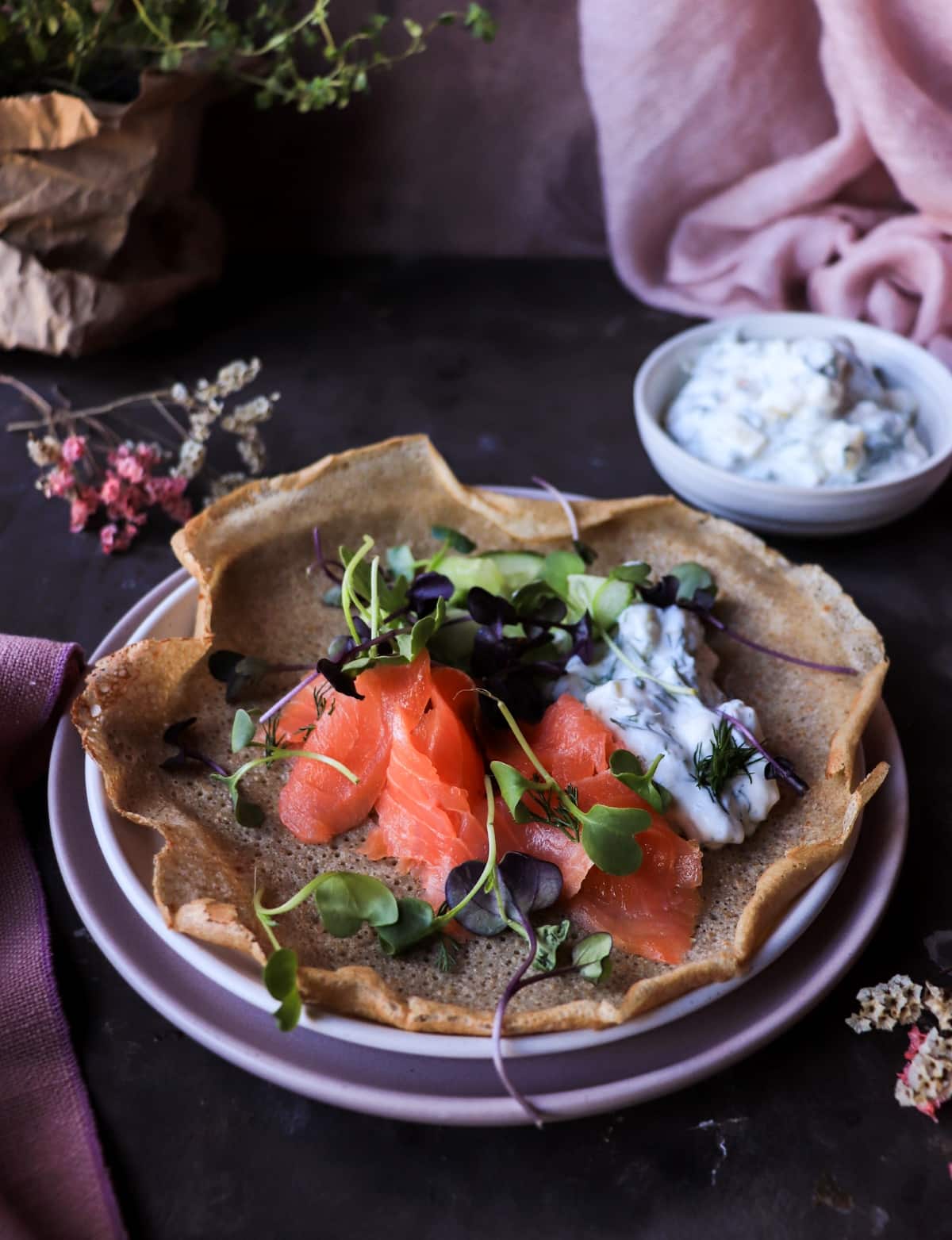 Savoury Nordic rye crêpes with dill yogurt sauce and smoked salmon.