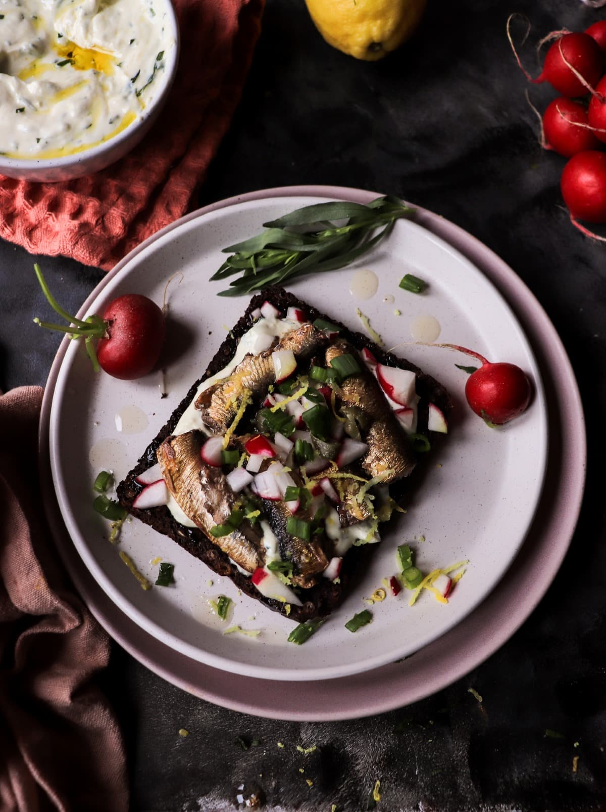 Baltic open sandwich with sprats on rye bread