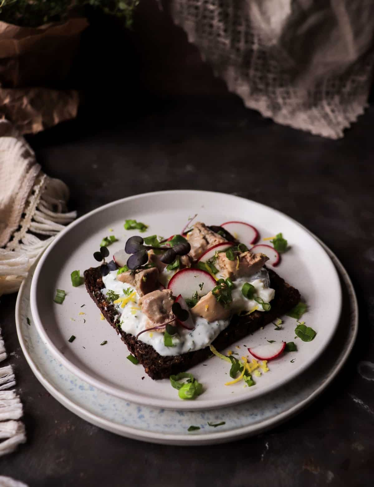 Nordic open-faced sandwich with smoked cod liver and fresh herbs