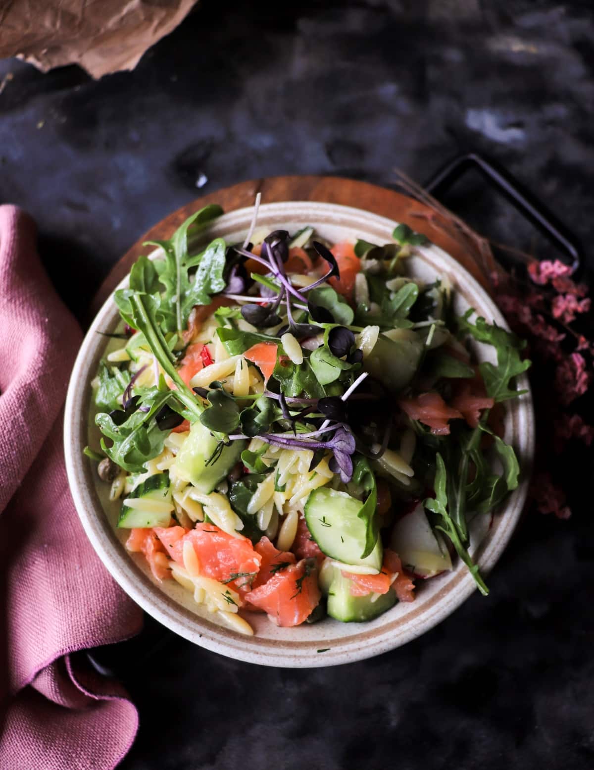 Smoked salmon orzo salad recipe with cucumber, herbs, and arugula.
