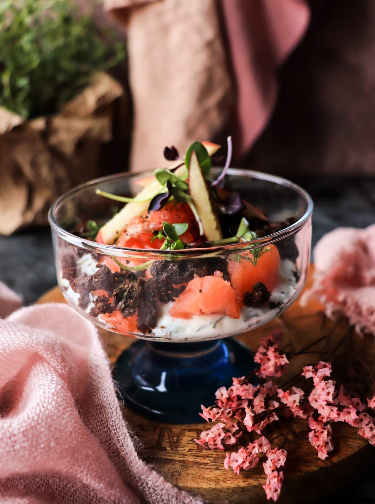 Elegant smoked salmon verrine appetizer with pumpernickel crumbs