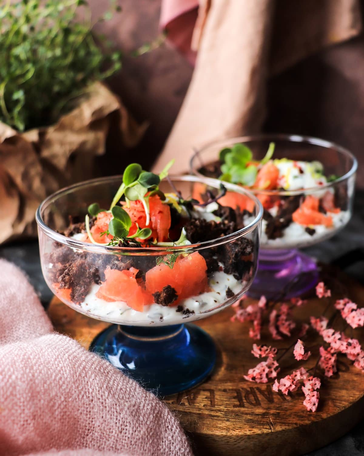 Smoked salmon appetizer with dill cream and rye bread crumbs
