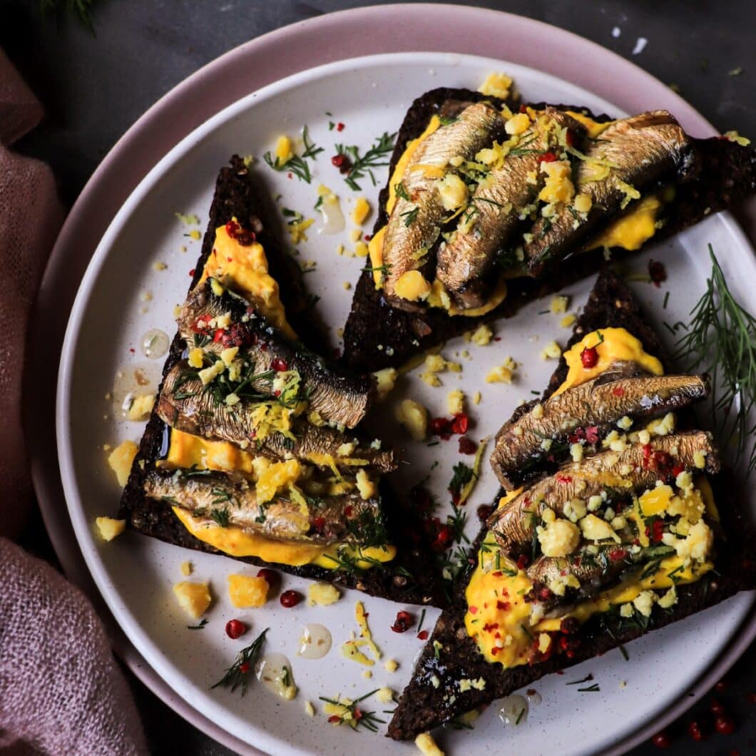Smoked Sprats on Rye with Saffron Yolk Mousse