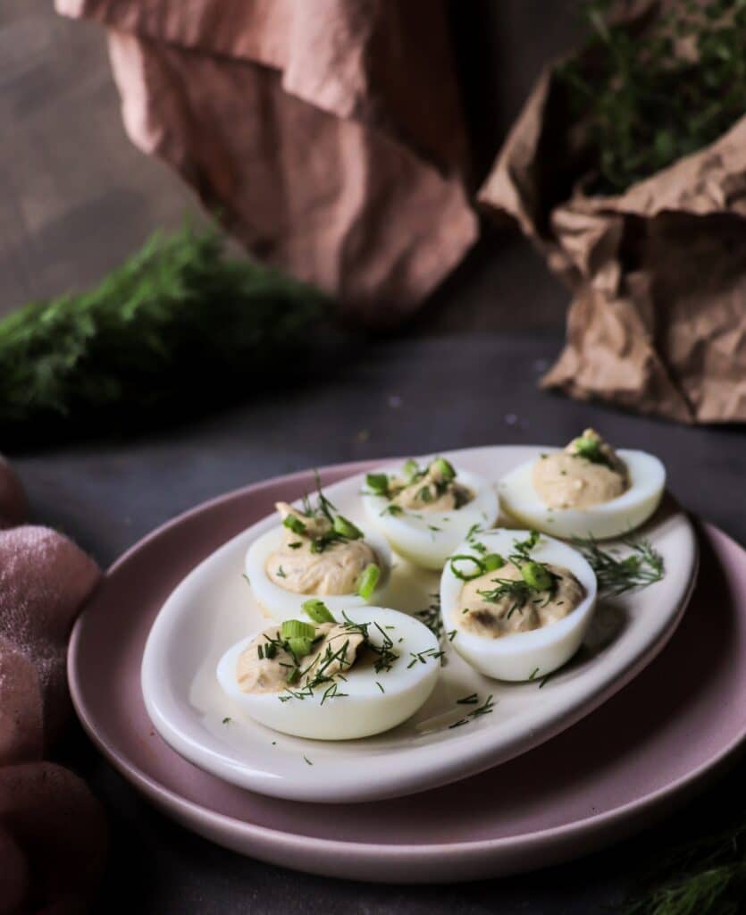 sprat deviled eggs with creamy yogurt filling and fresh dill