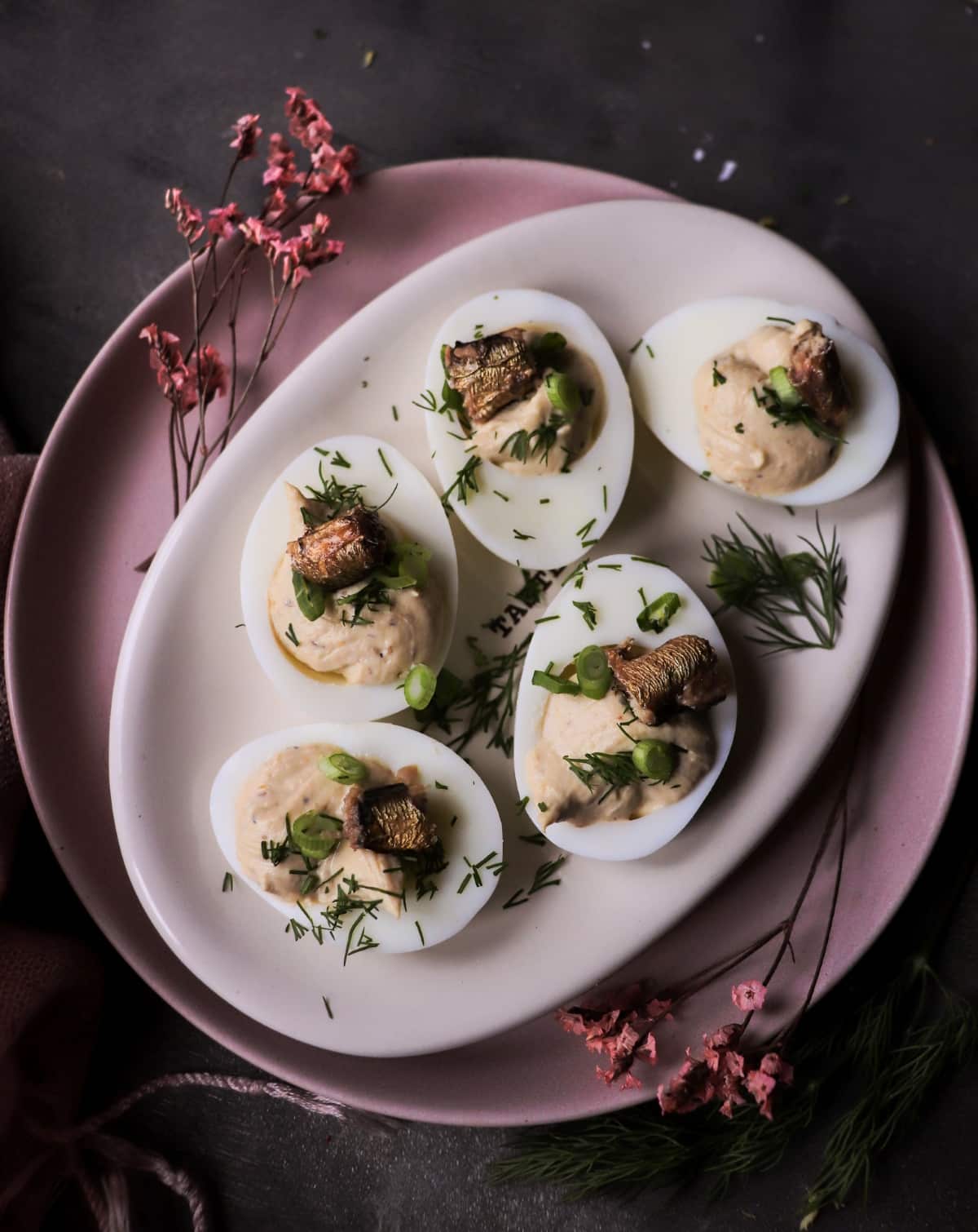 Nordic-inspired deviled eggs with smoked sprats and yogurt filling.