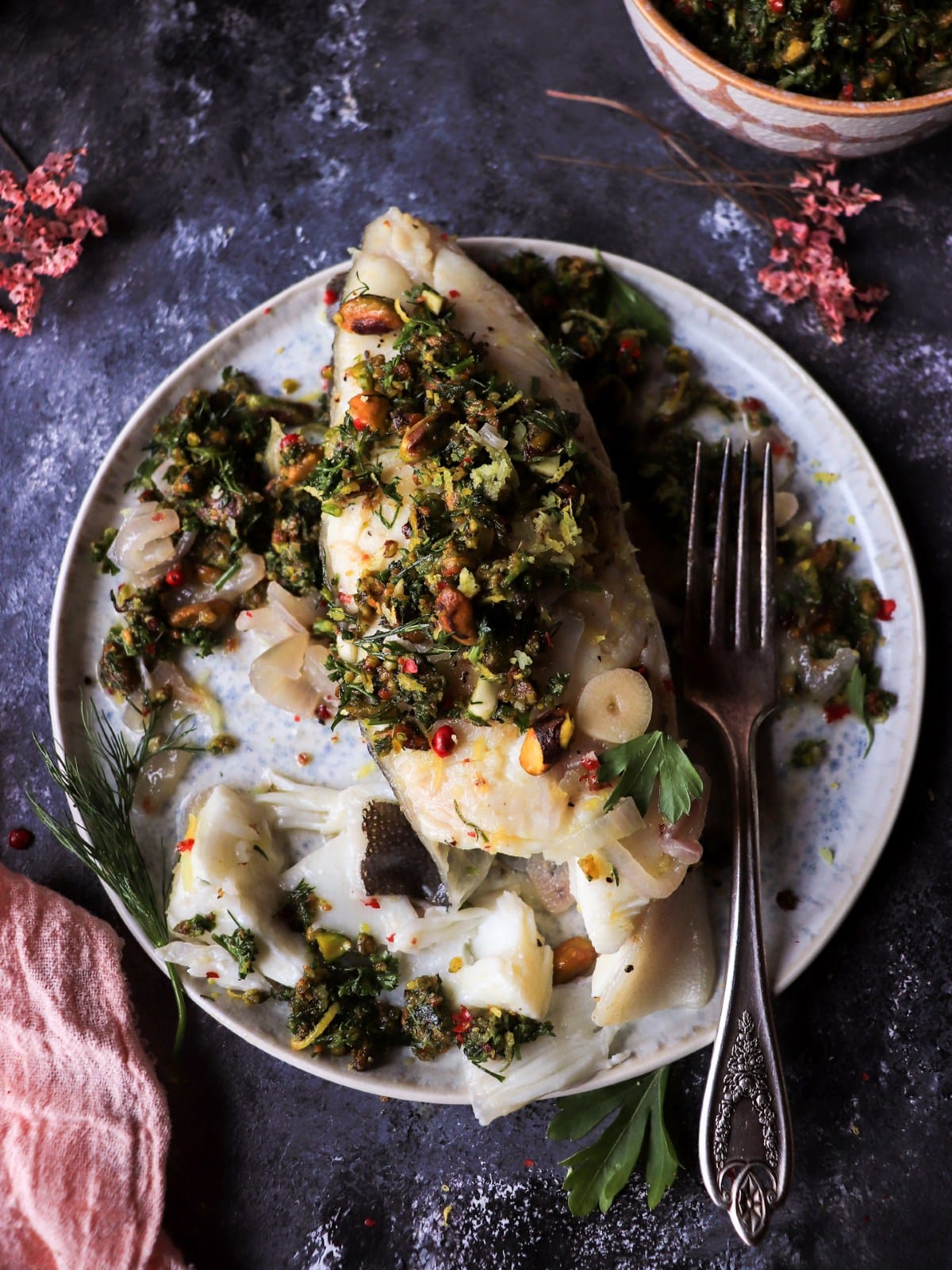 Pan-seared halibut with lemon and pistachio gremolata.